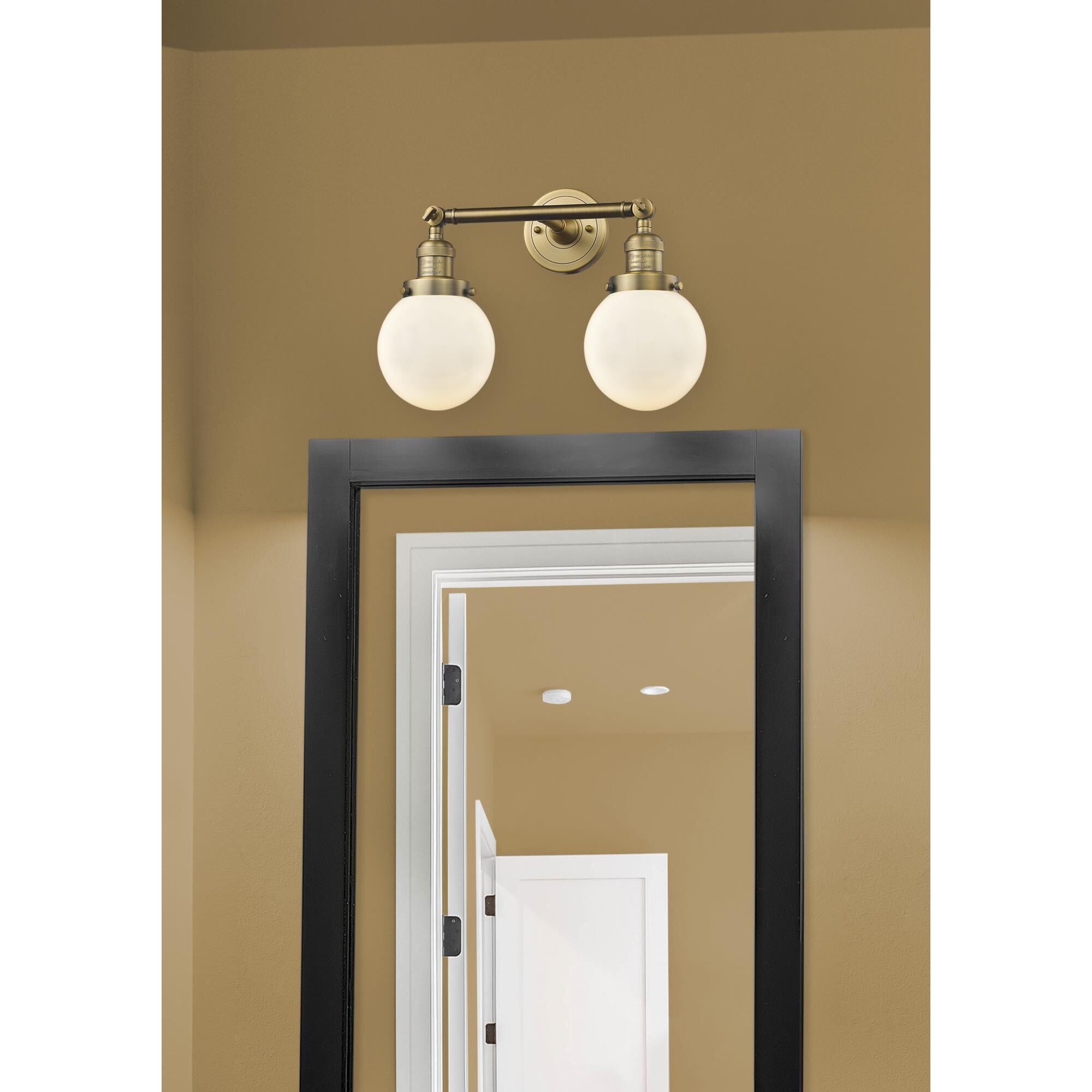 Shown in Brushed Brass finish and Matte White Cased glass