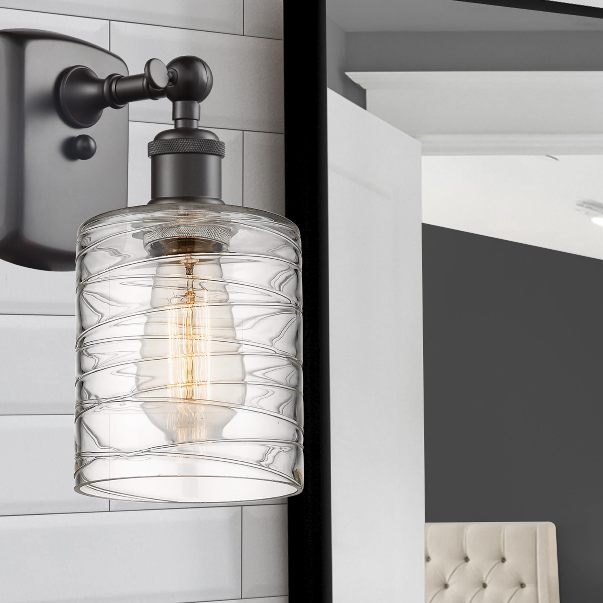 Shown in Oil Rubbed Bronze finish and Deco Swirl glass