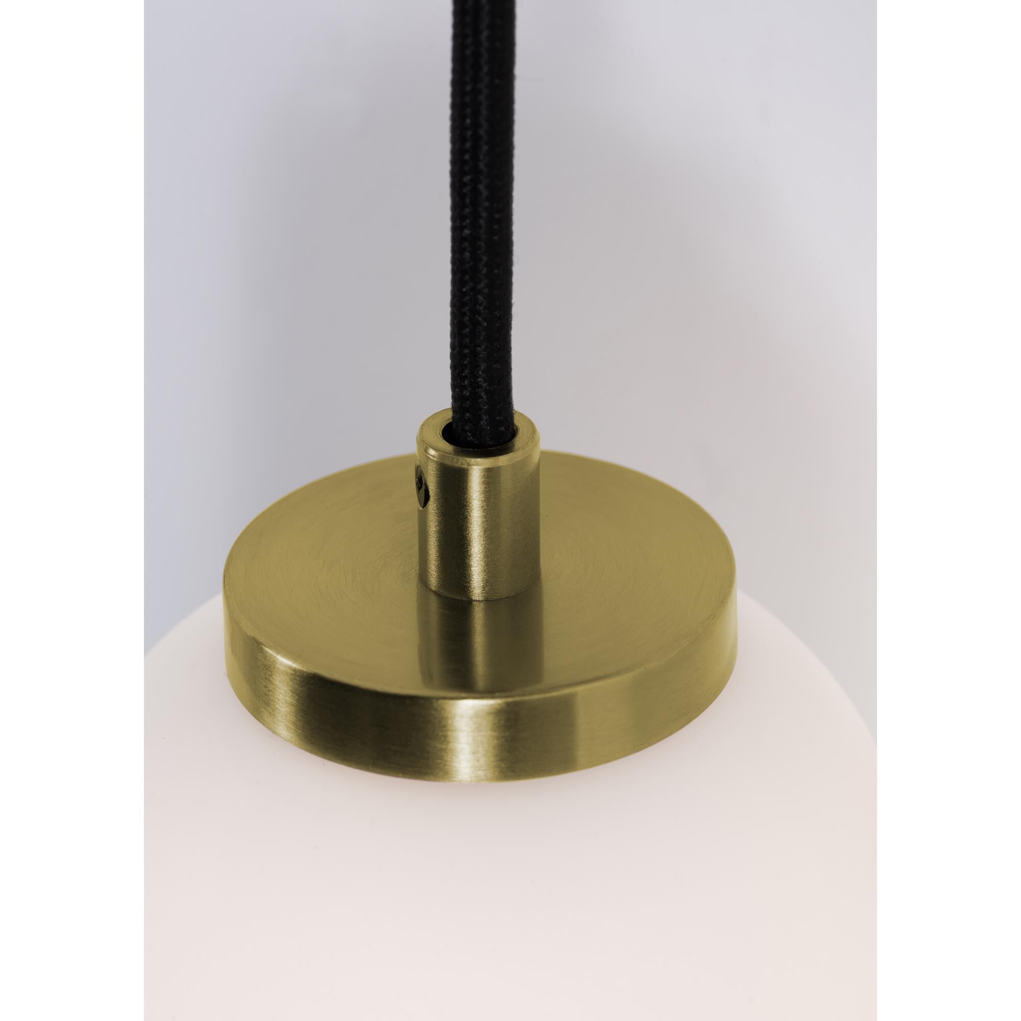 Shown in Light Antique Brass finish and White glass