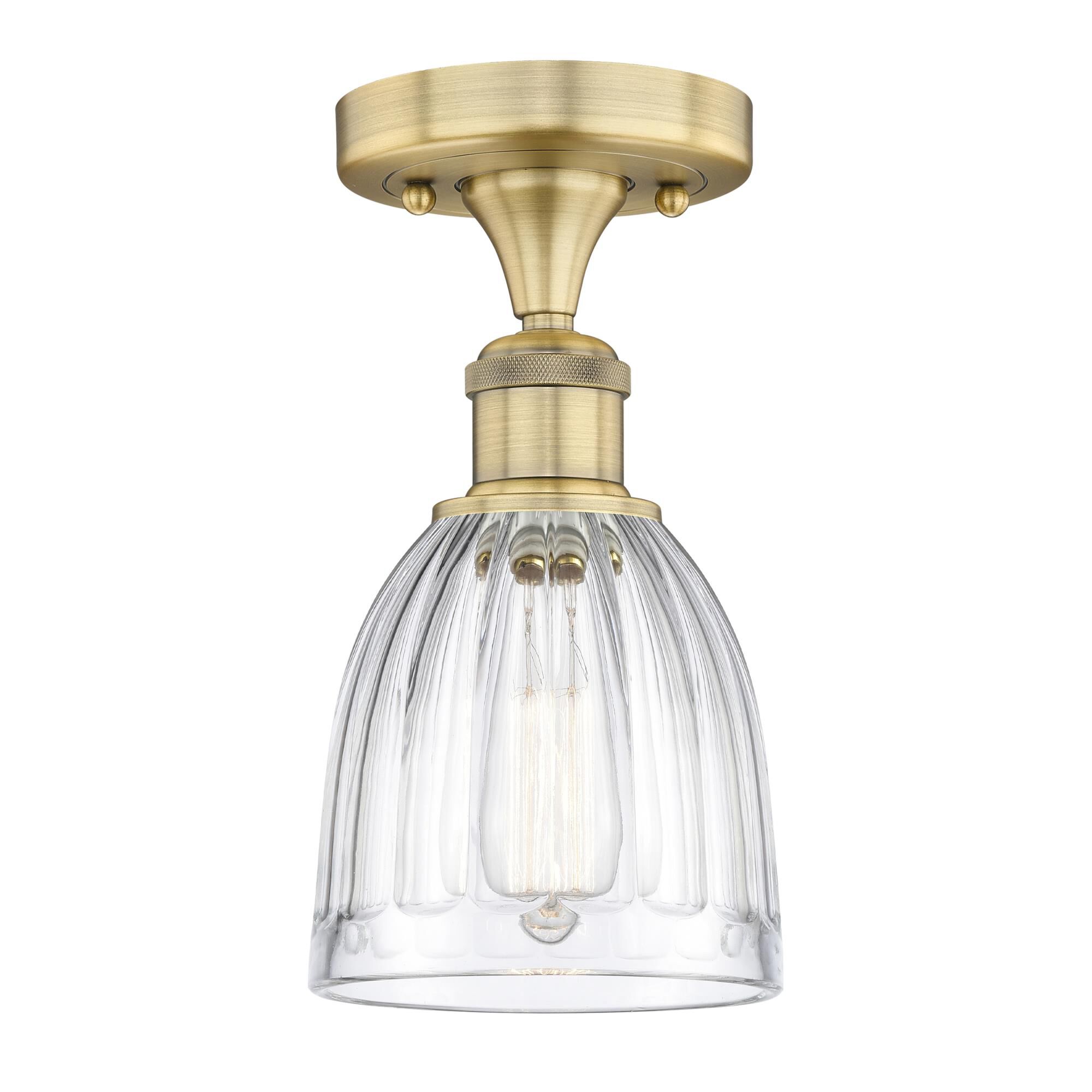 Shown in Brushed Brass finish and Clear glass