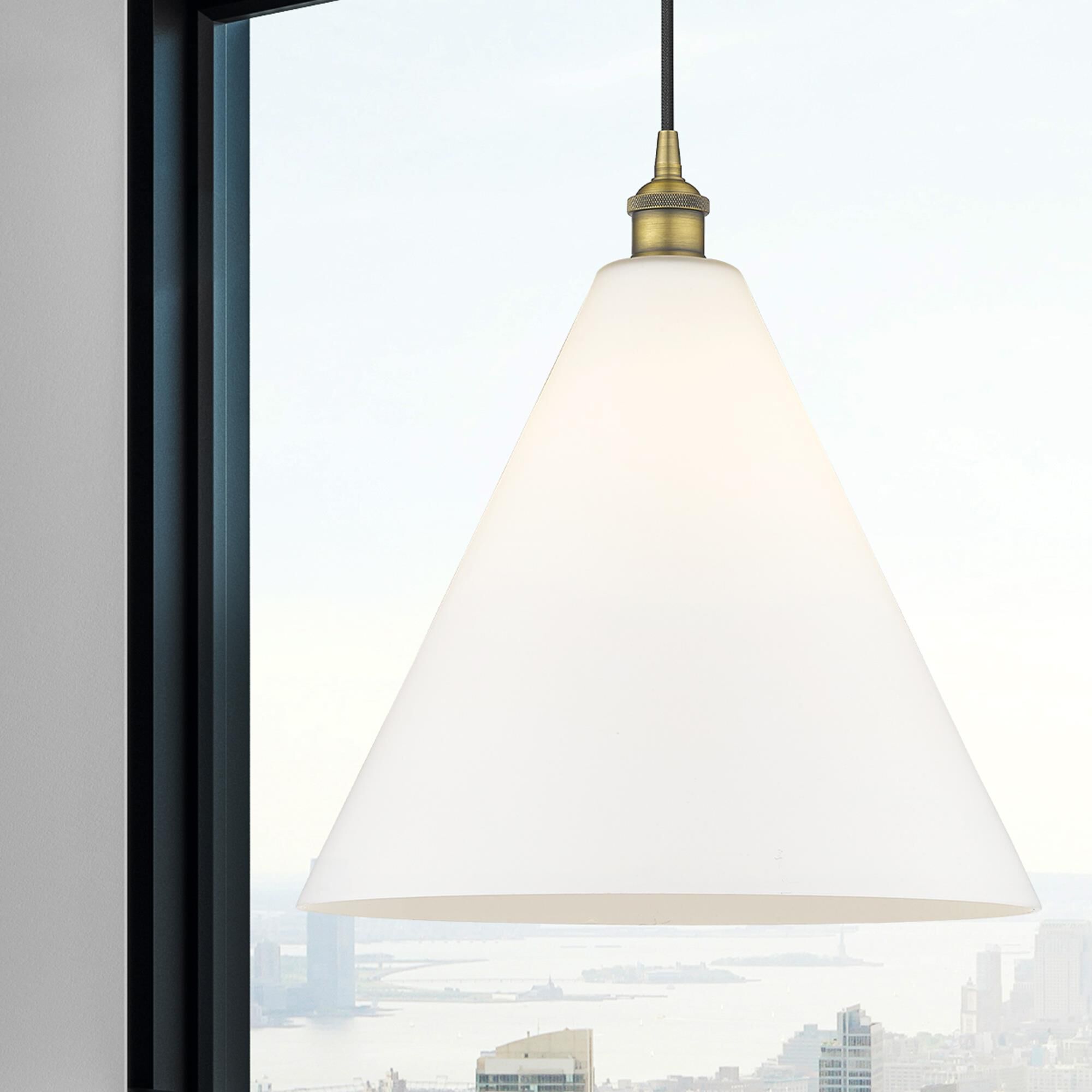 Shown in Brushed Brass finish and Matte White glass