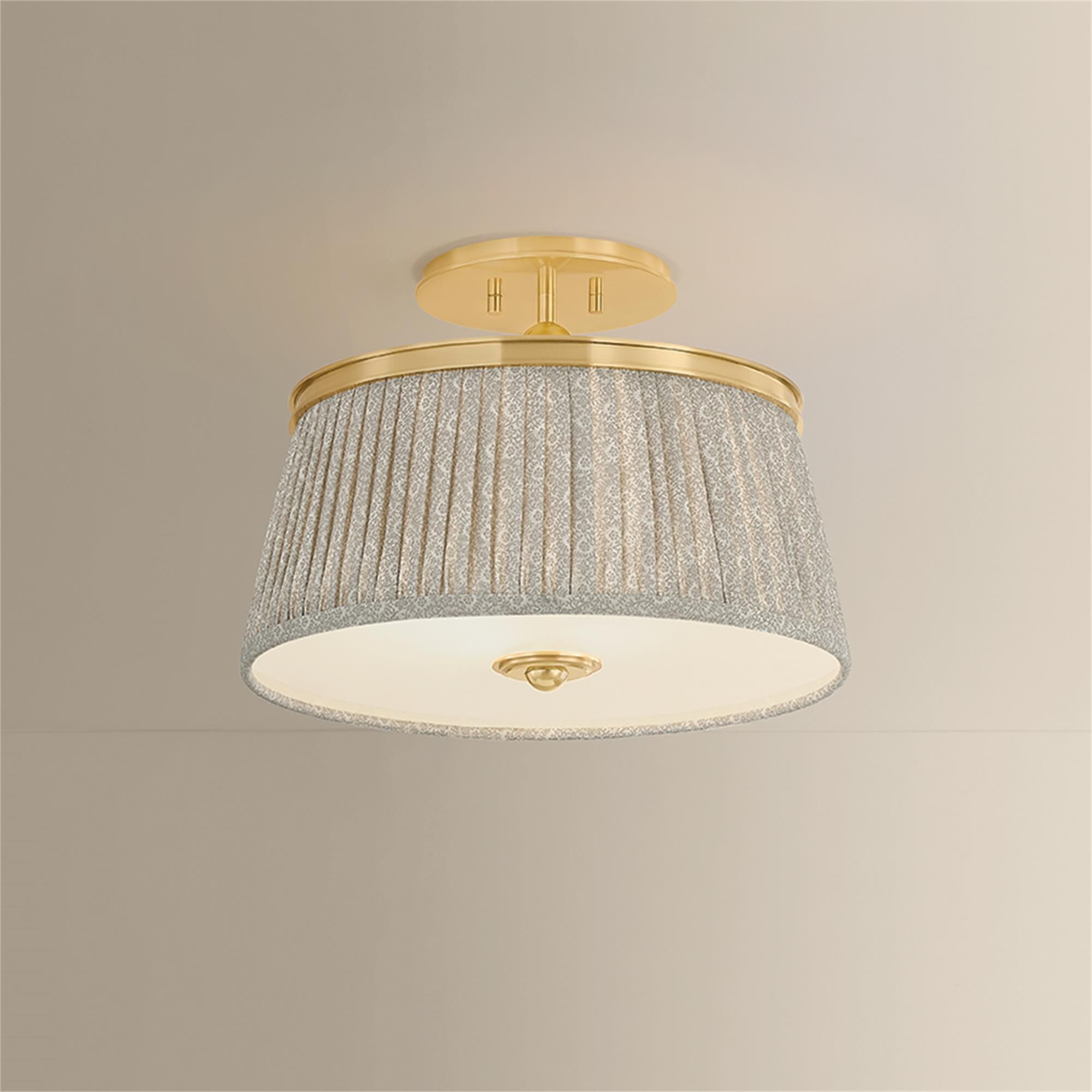Shown in Aged Brass finish and Gathered Printed Cotton shade