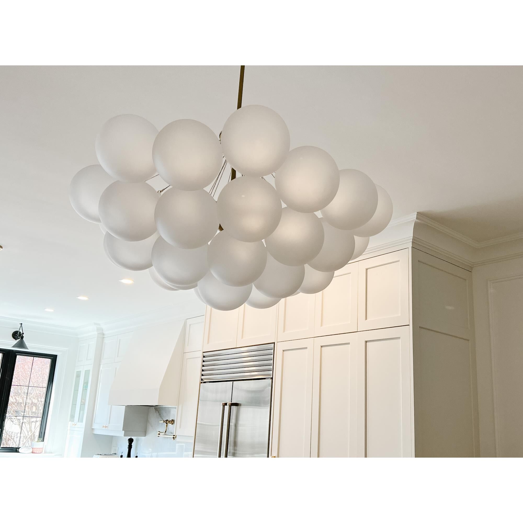 Shown in Aged Brass finish and Opal White accent