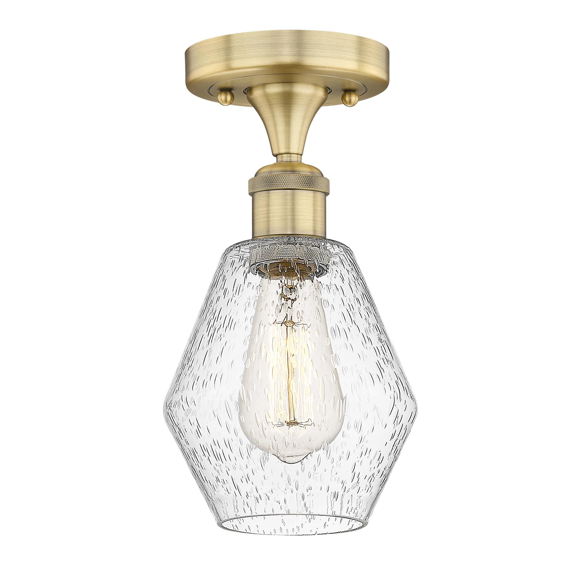 Shown in Brushed Brass finish and Seedy glass