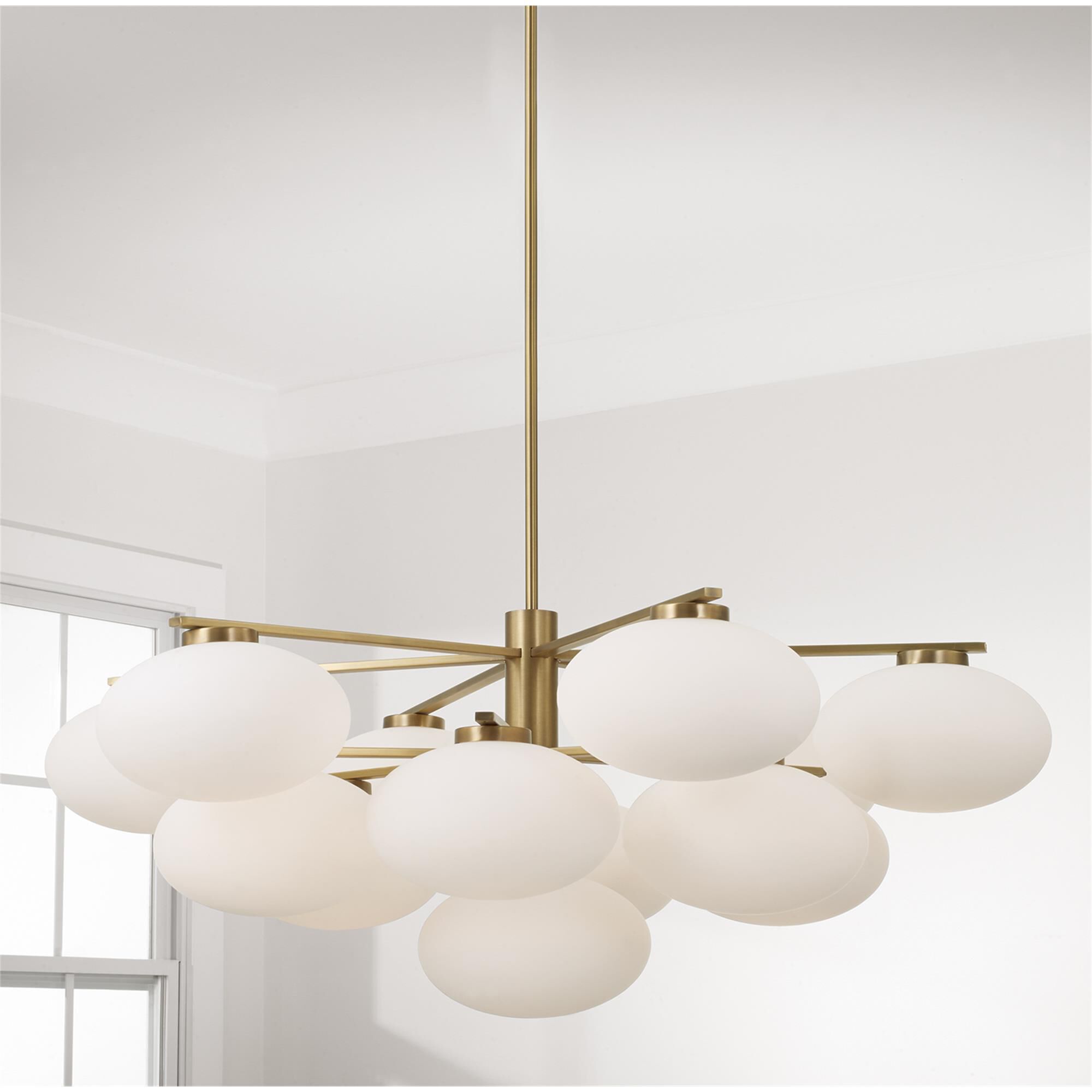Shown in Aged Brass finish and Soft White glass