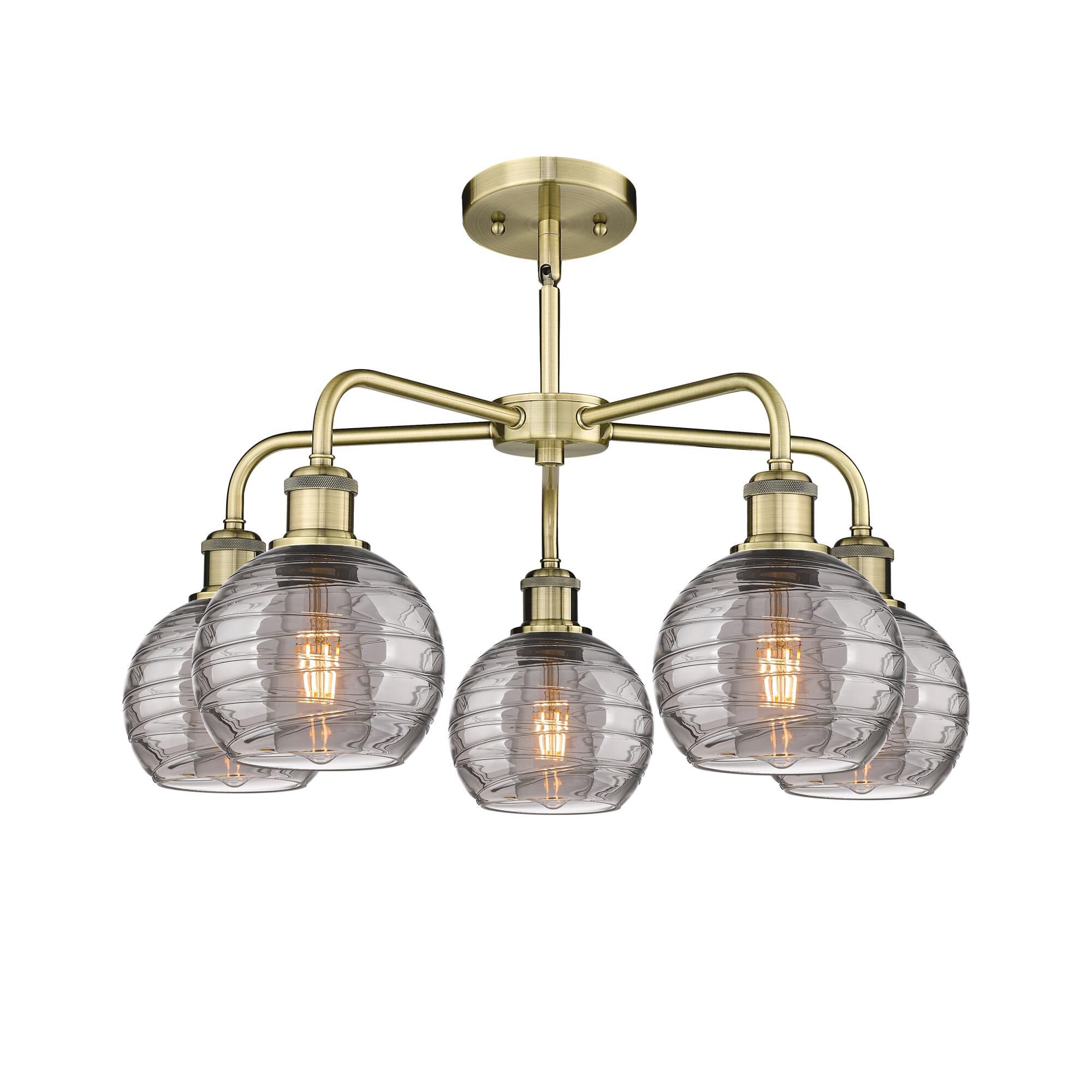 Shown in Antique Brass finish and Light Smoke Deco Swirl glass