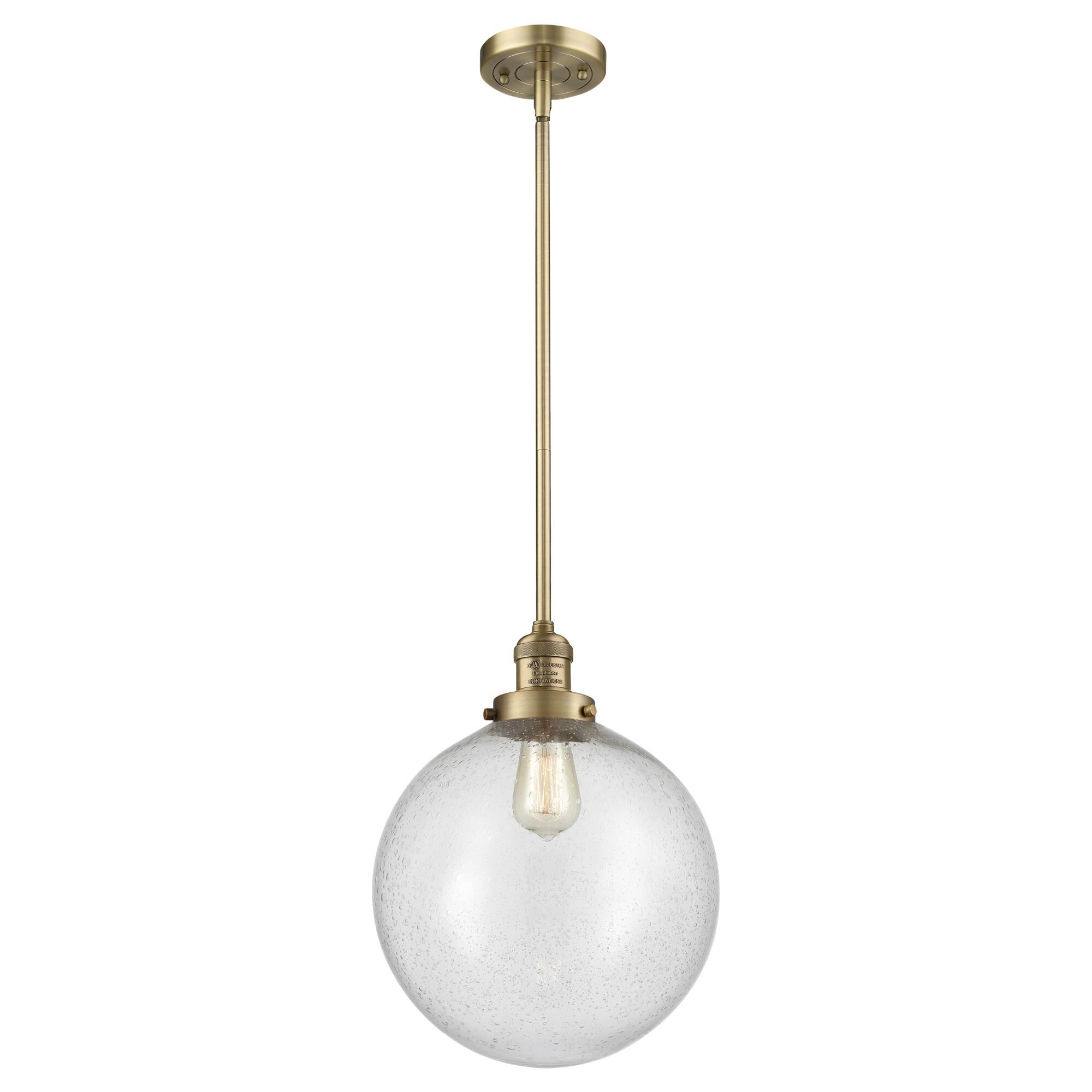Shown in Brushed Brass finish and Seedy Beacon glass