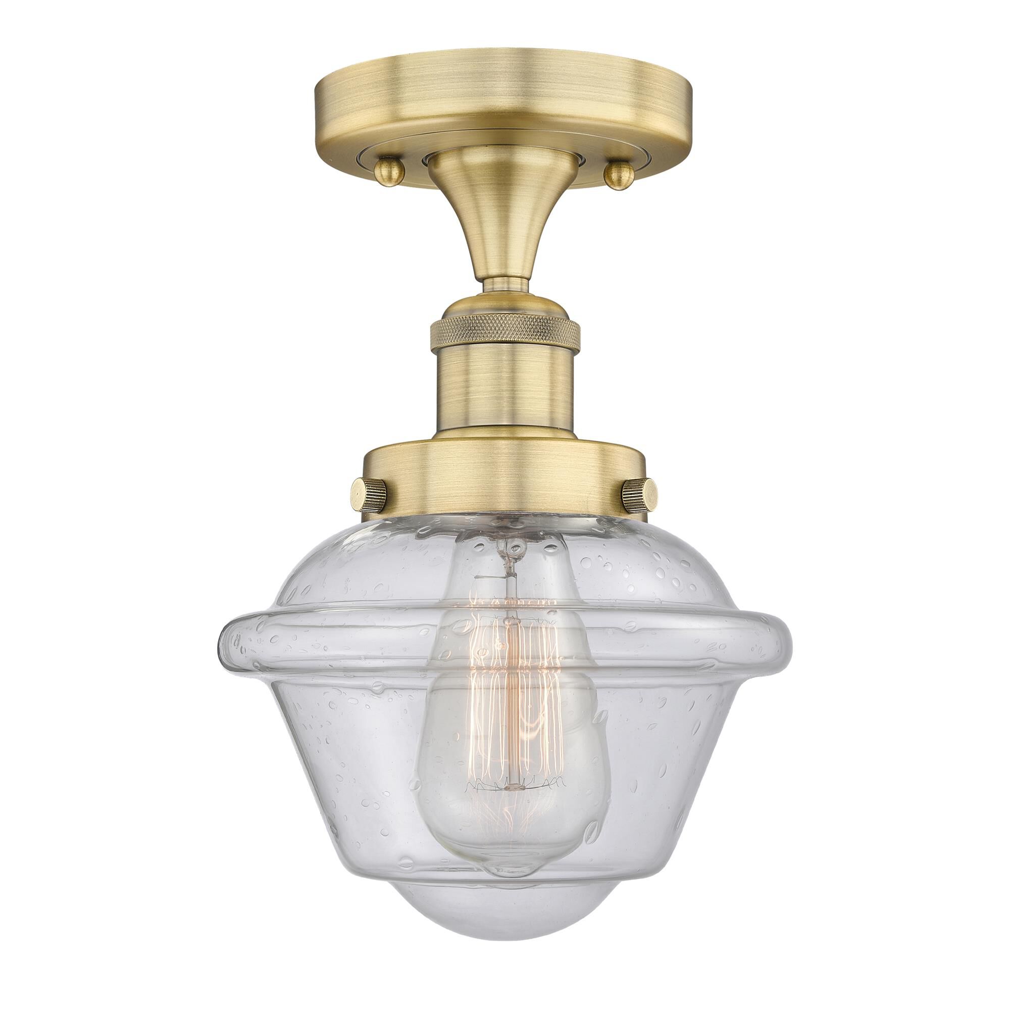 Shown in Brushed Brass finish and Seedy glass