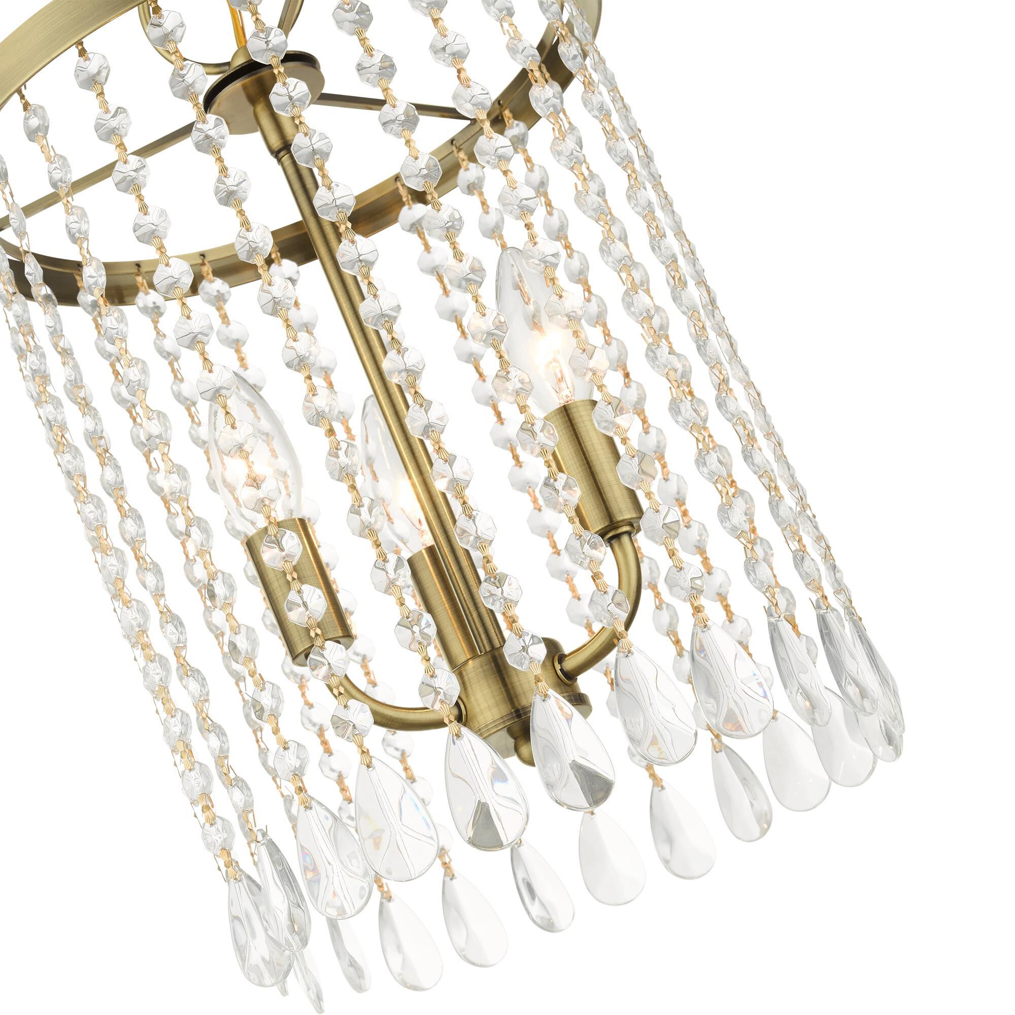Shown in Antique Brass finish and Hand Assembled Crystal Shade glass