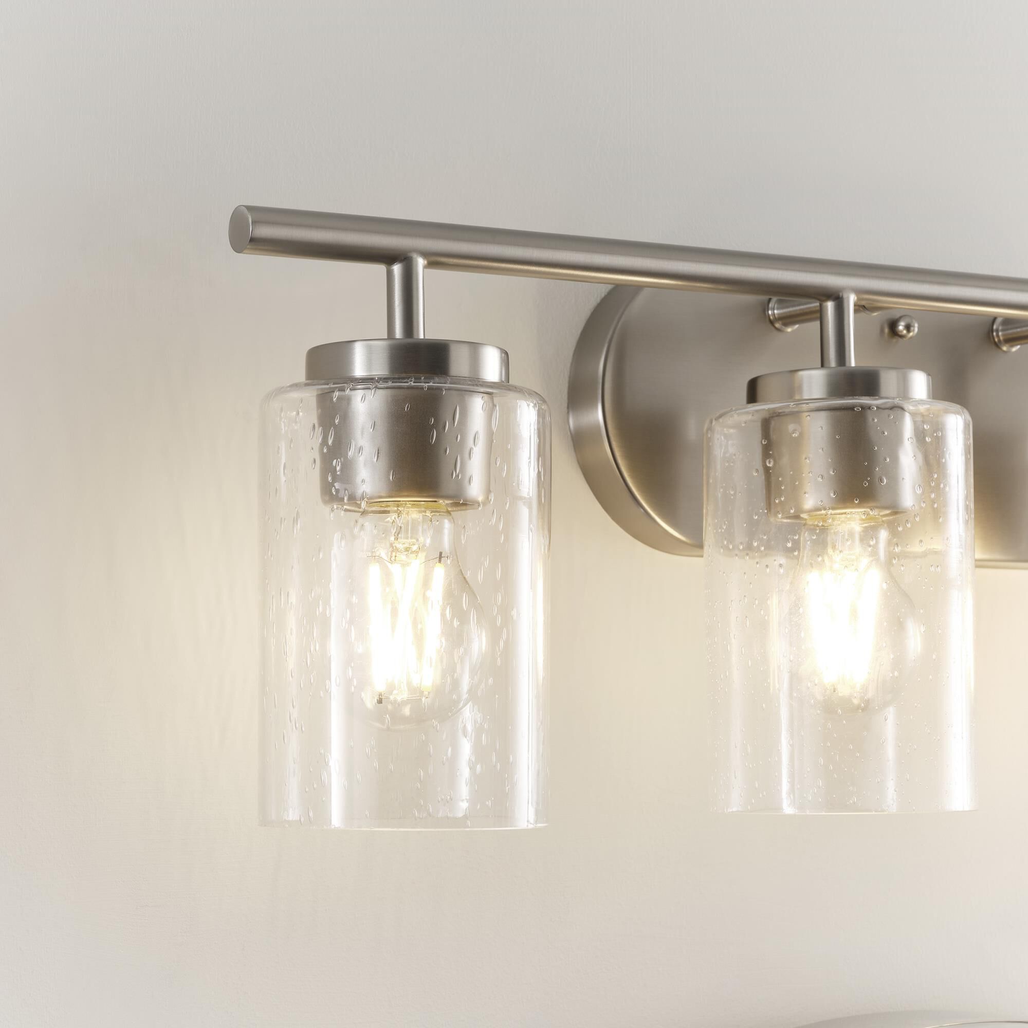 Shown in Brushed Nickel finish and Clear Seeded glass