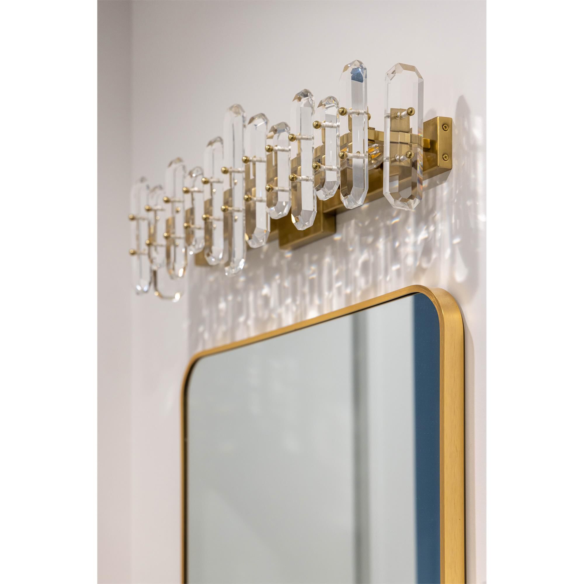 Shown in Aged Brass finish and Faceted Crystal Elements crystal