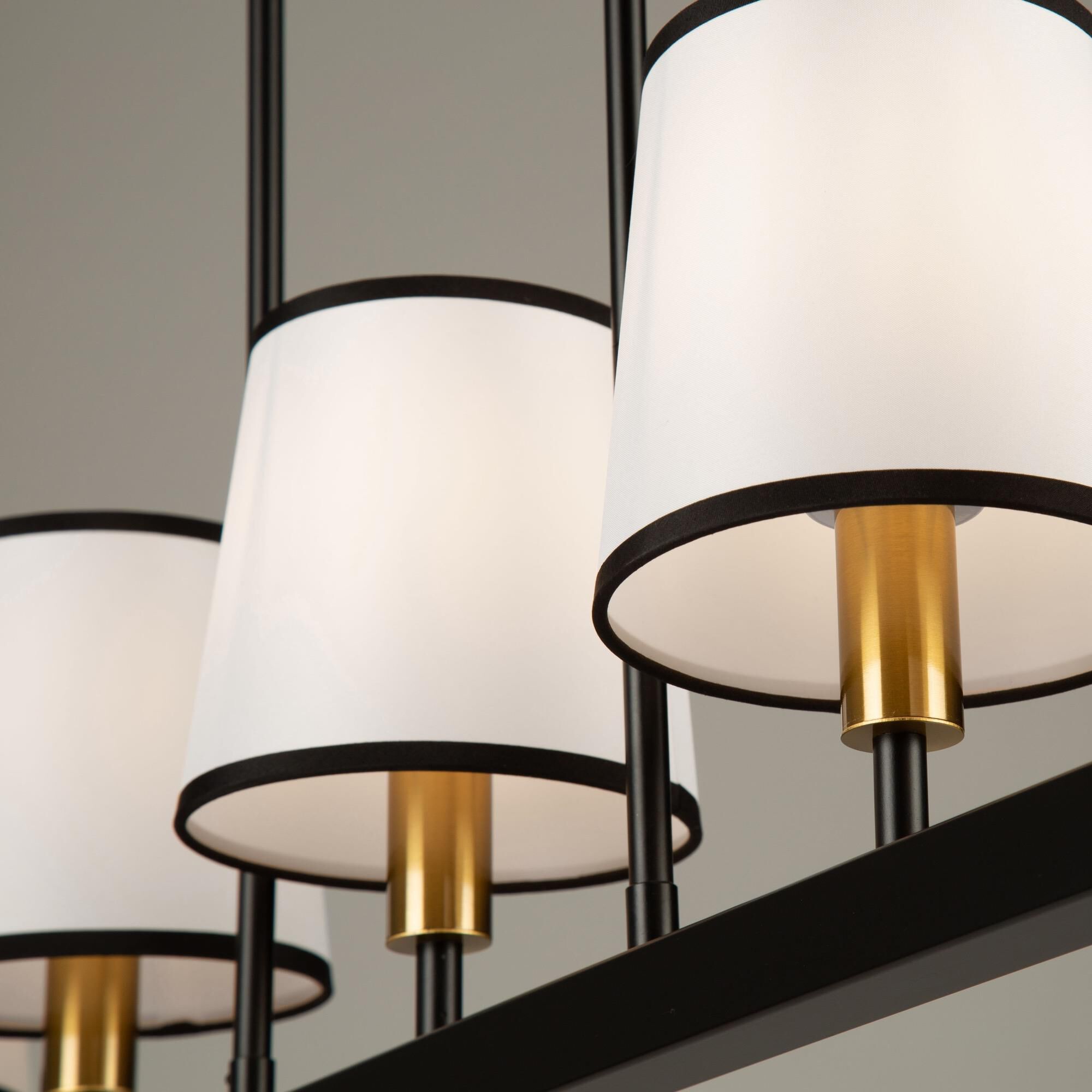 Shown in Gold and Black finish and White Linen shade