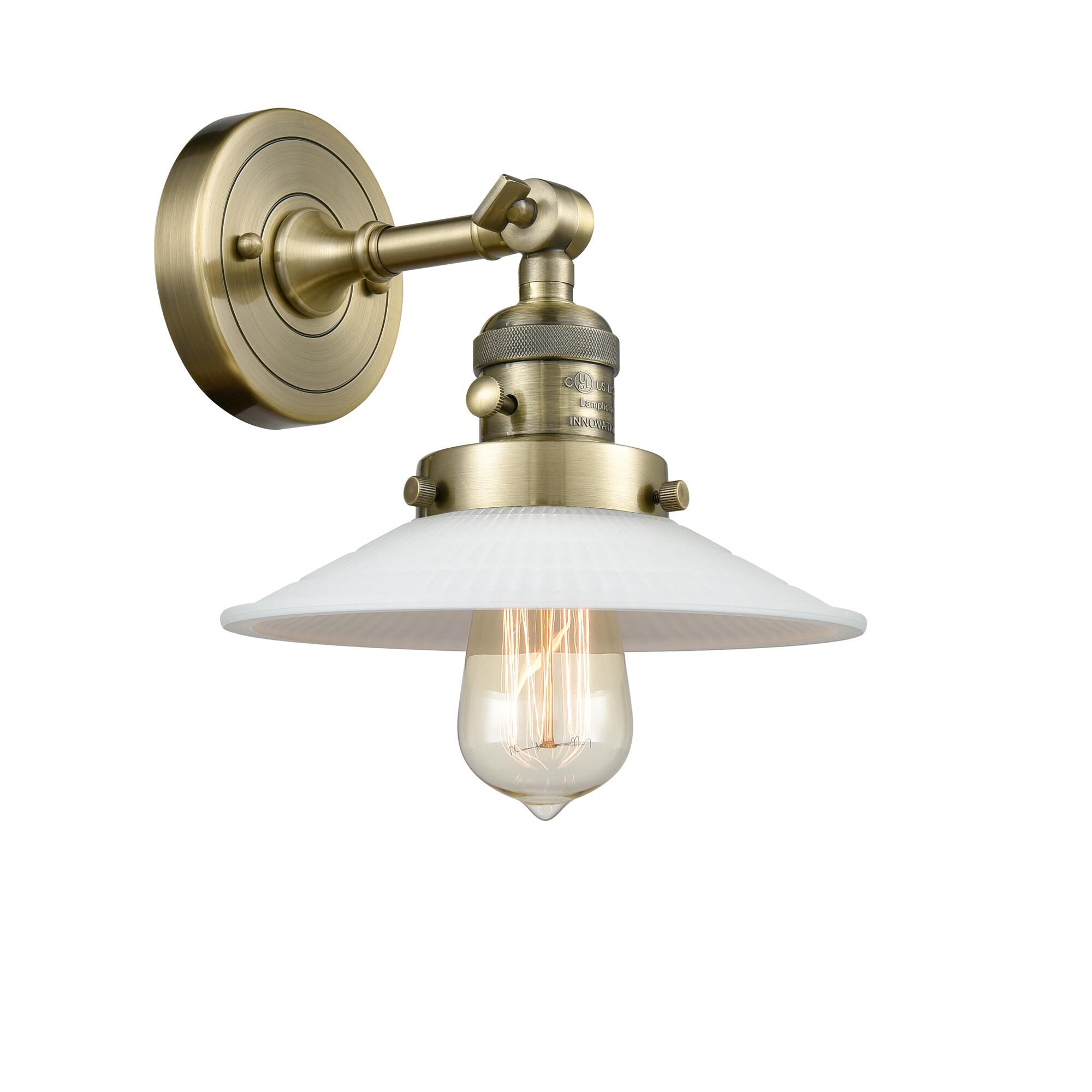 Shown in Antique Brass finish and Matte White Halophane - Cone glass