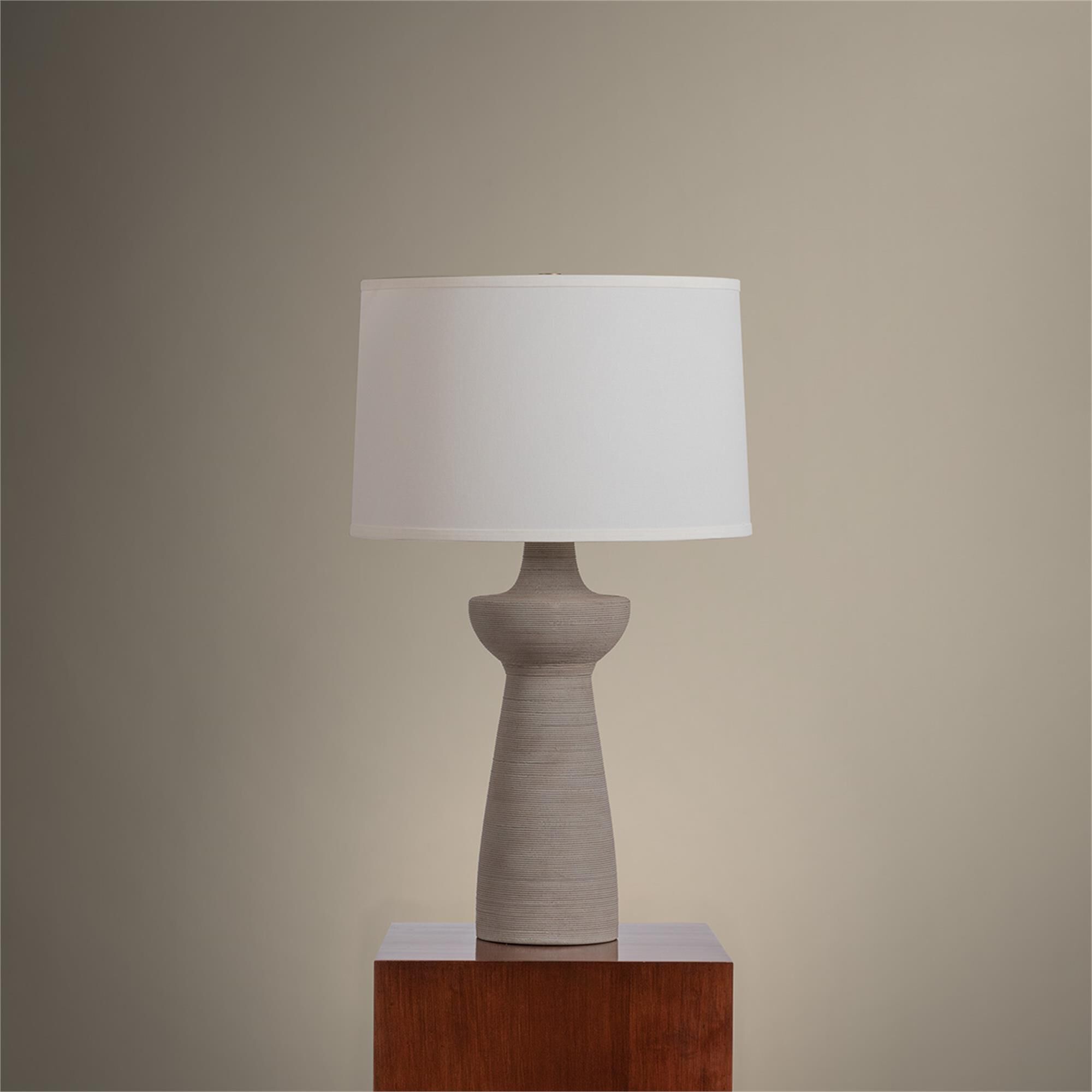 Shown in Patina Brass finish and Off White Linen shade