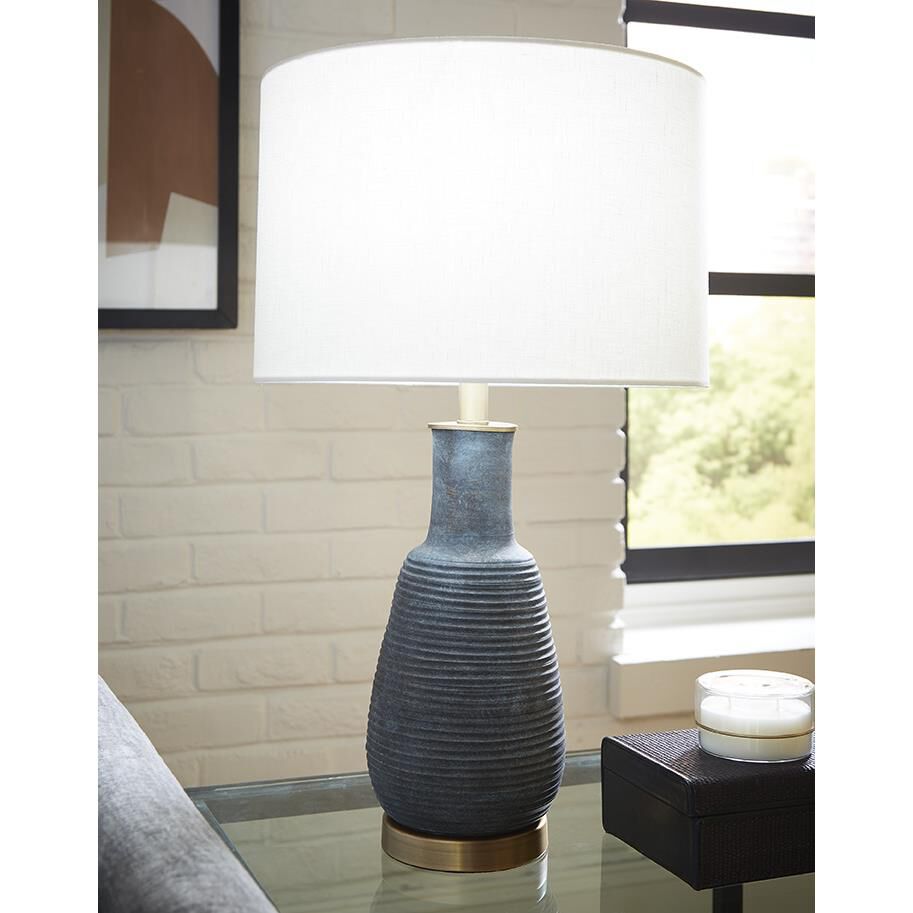 Shown in Brass finish and Seasalt glass and Seasalt Linen Drum shade