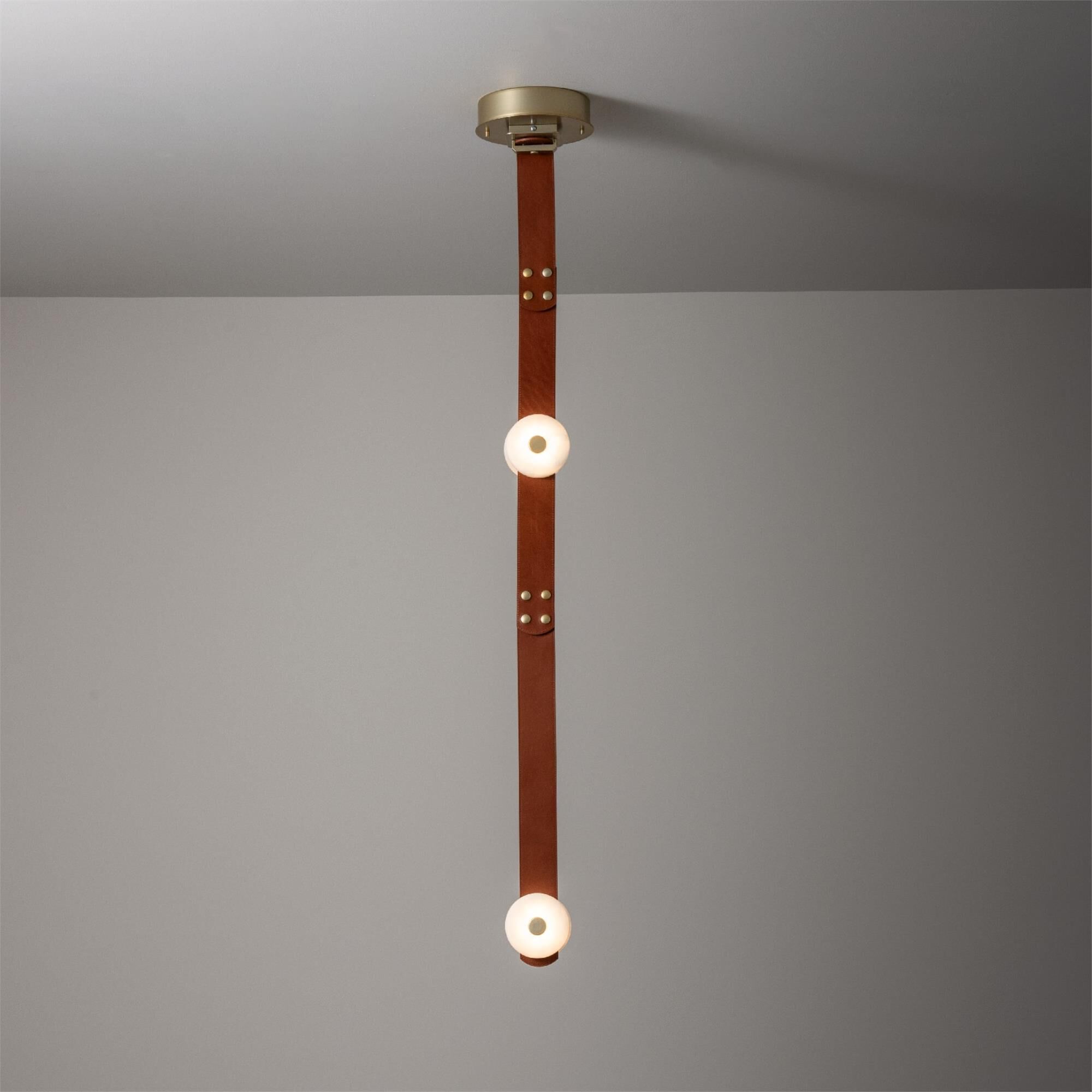 Shown in Modern Brass finish and Alabaster shade and Chestnut accent