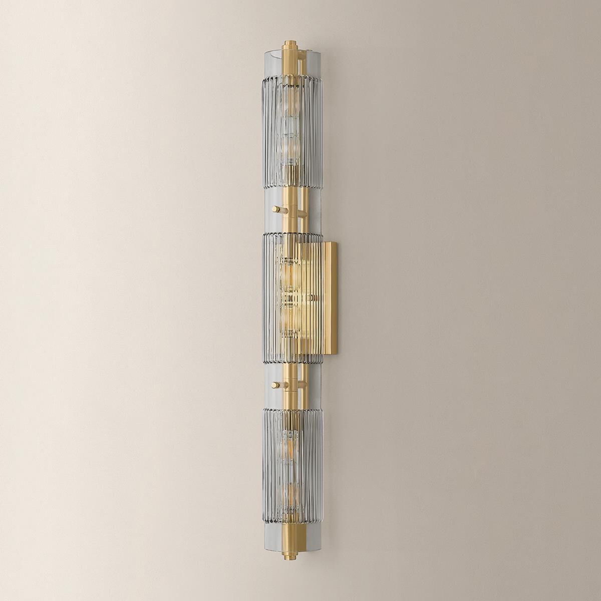 Shown in Vintage Brass finish and Clear Smoke glass