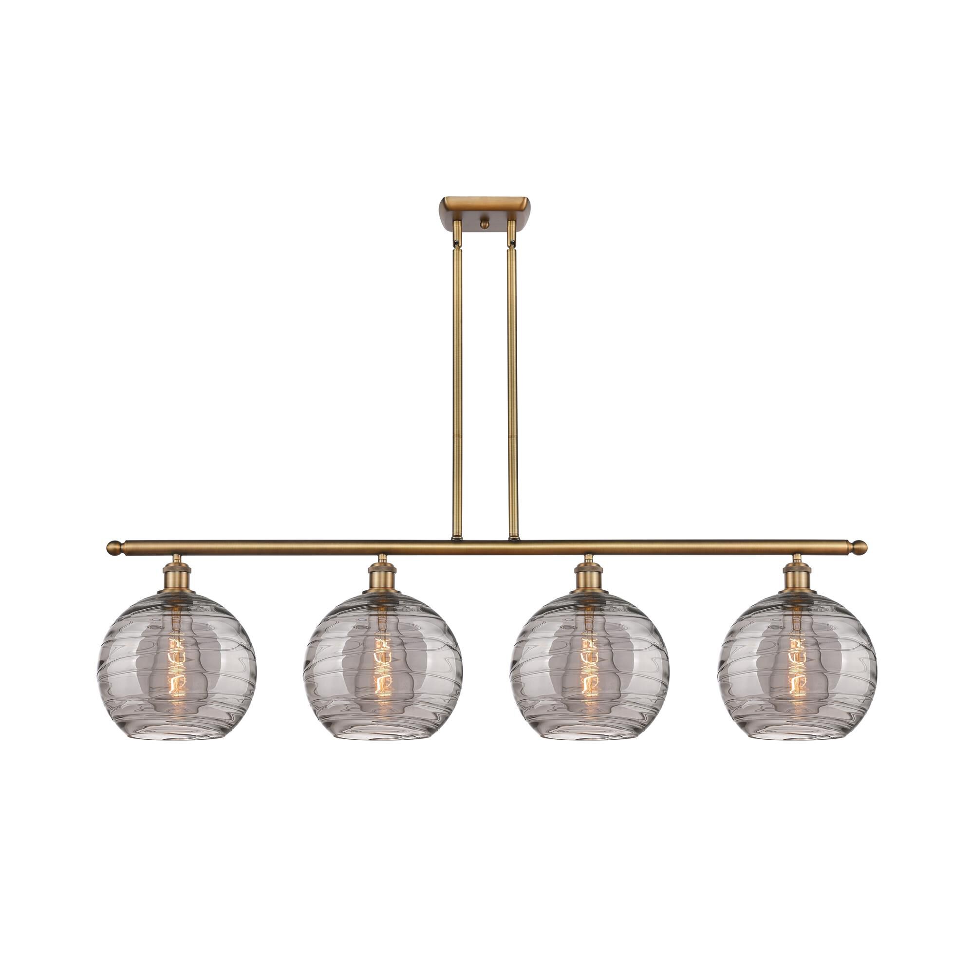 Shown in Brushed Brass finish and Light Smoke Deco Swirl glass