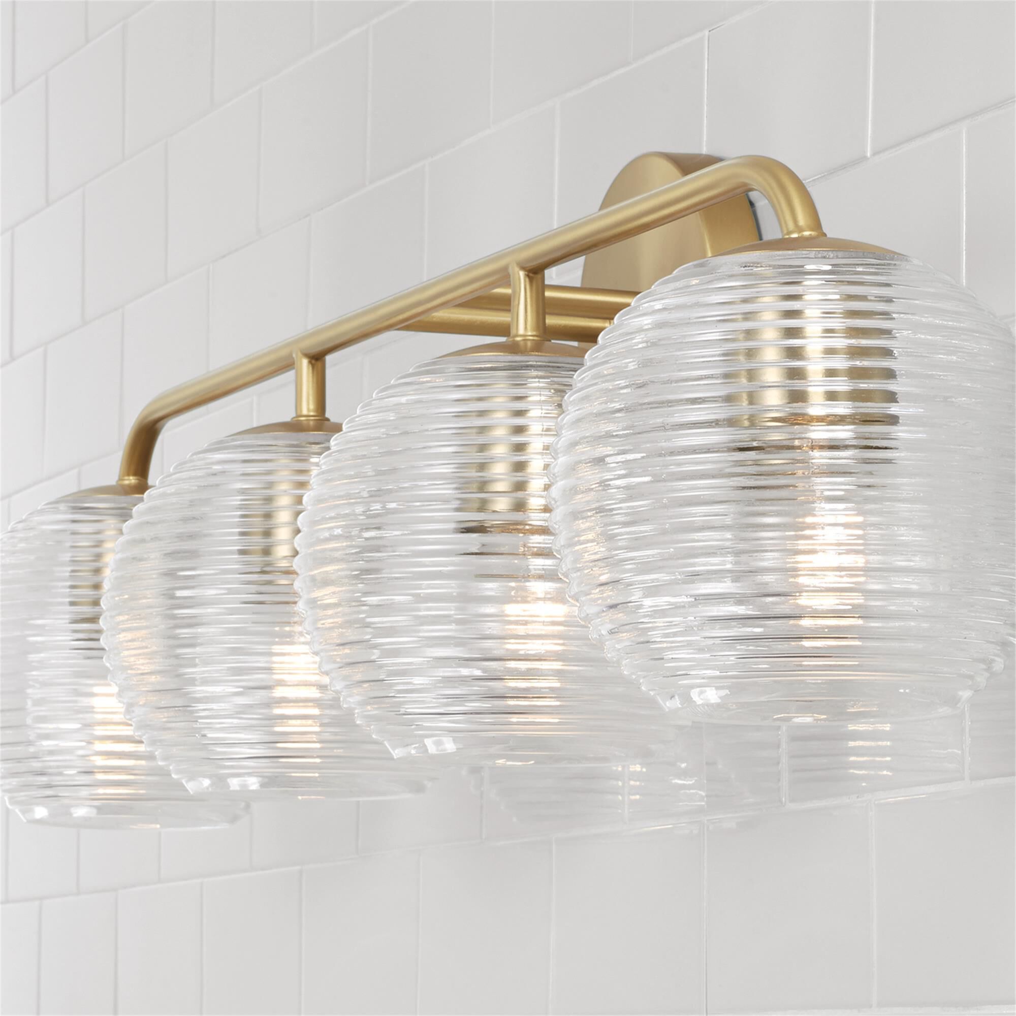 Shown in Matte Brass finish and Clear Ribbed glass