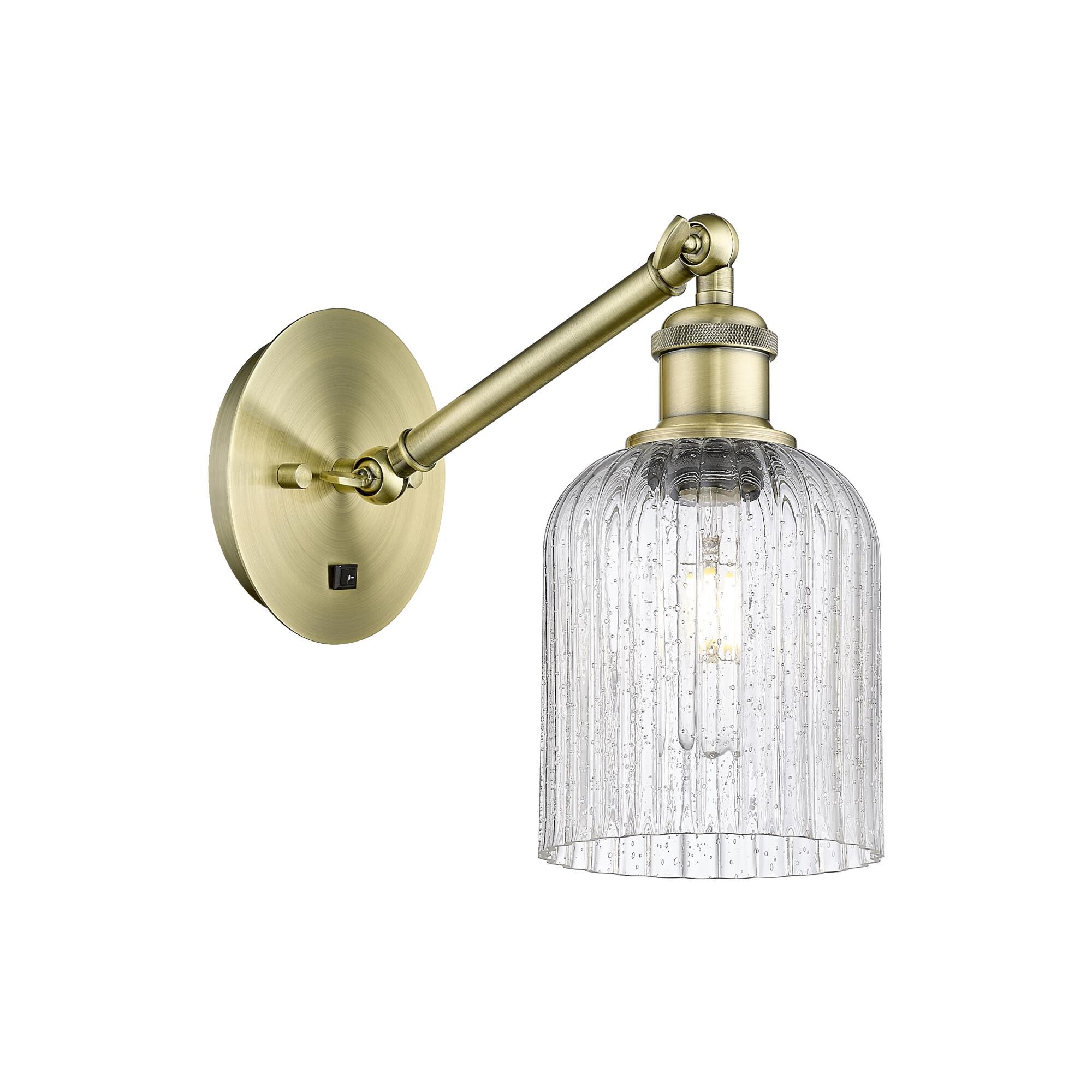 Shown in Antique Brass finish and Seedy shade