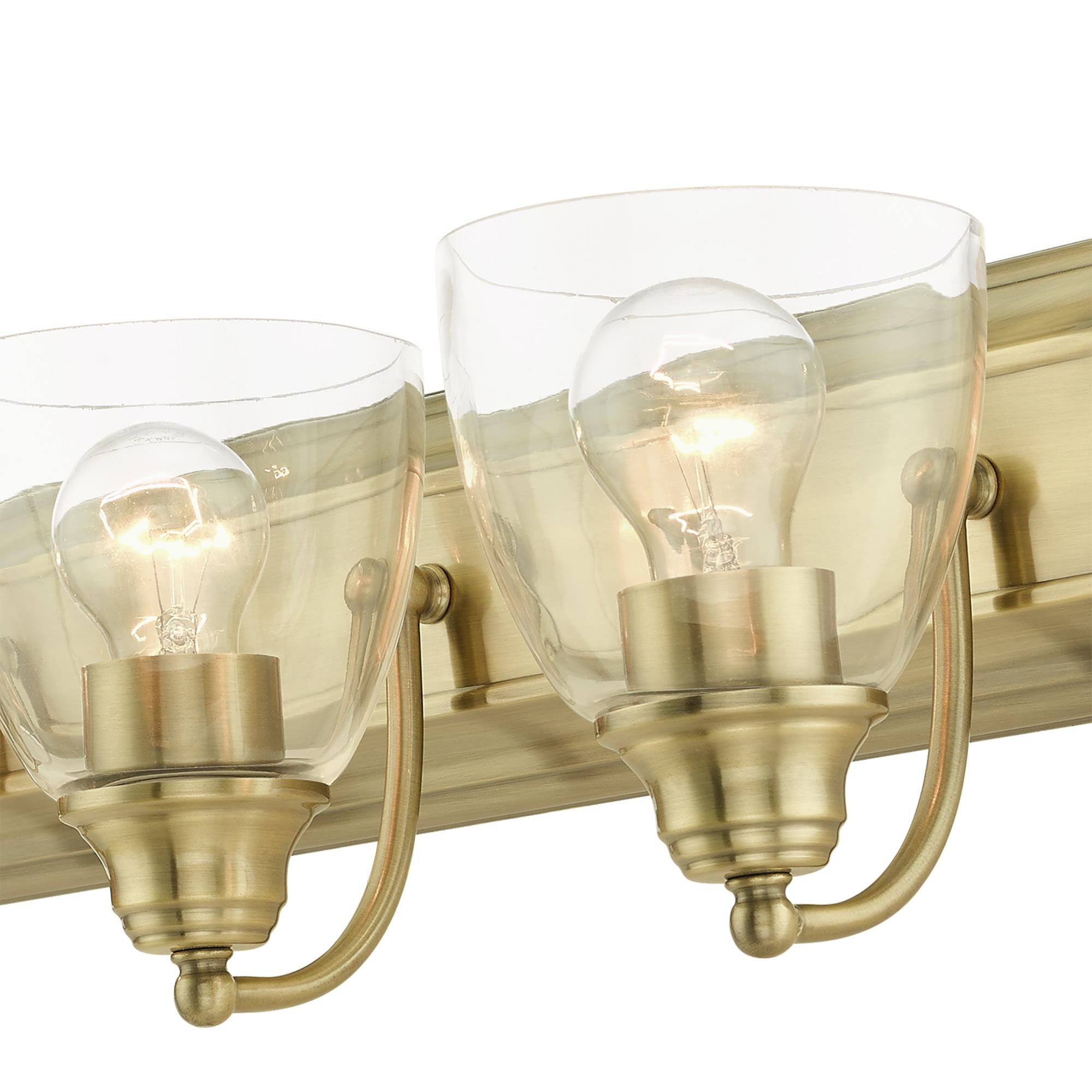 Shown in Antique Brass finish and Hand Blown Clear glass