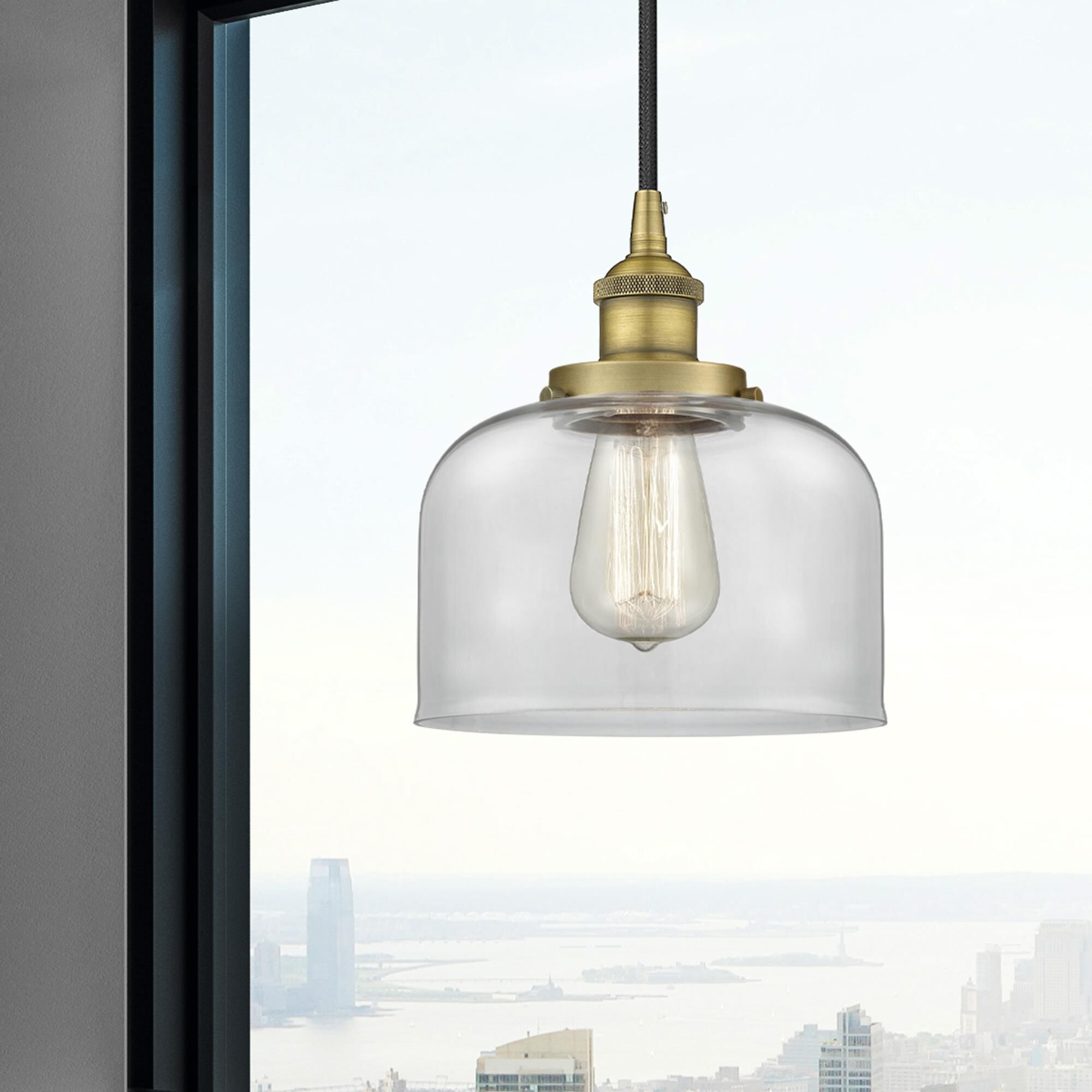 Shown in Brushed Brass finish and Clear Large Bell glass