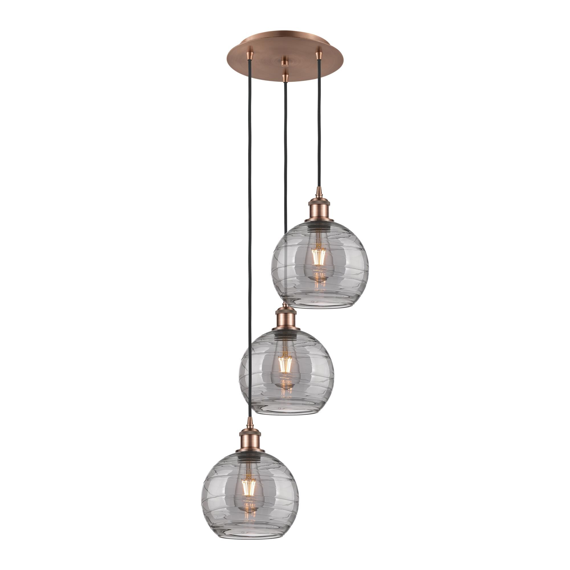 Shown in Antique Copper finish and Light Smoke Deco Swirl glass