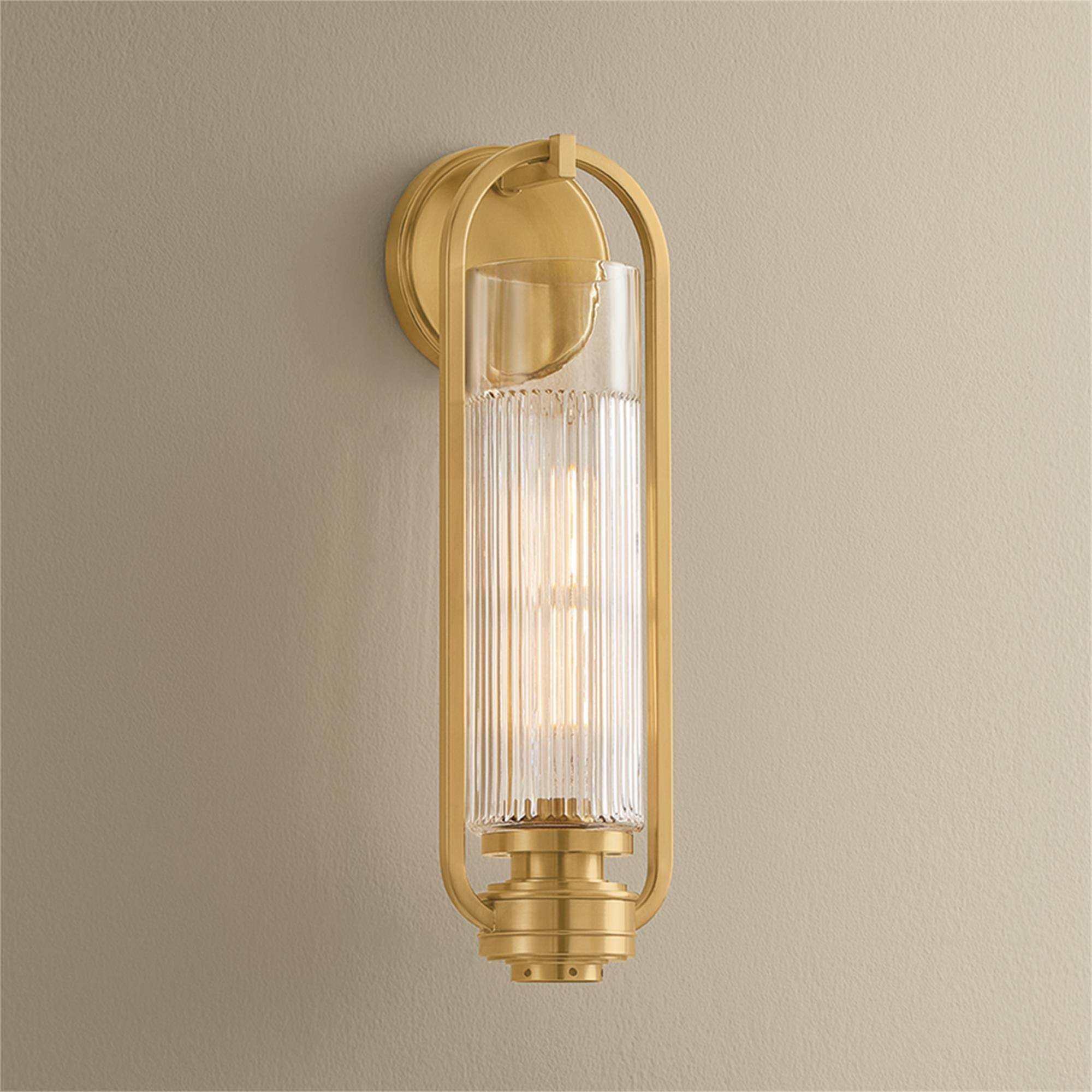 Shown in Aged Brass finish and Clear Optic glass