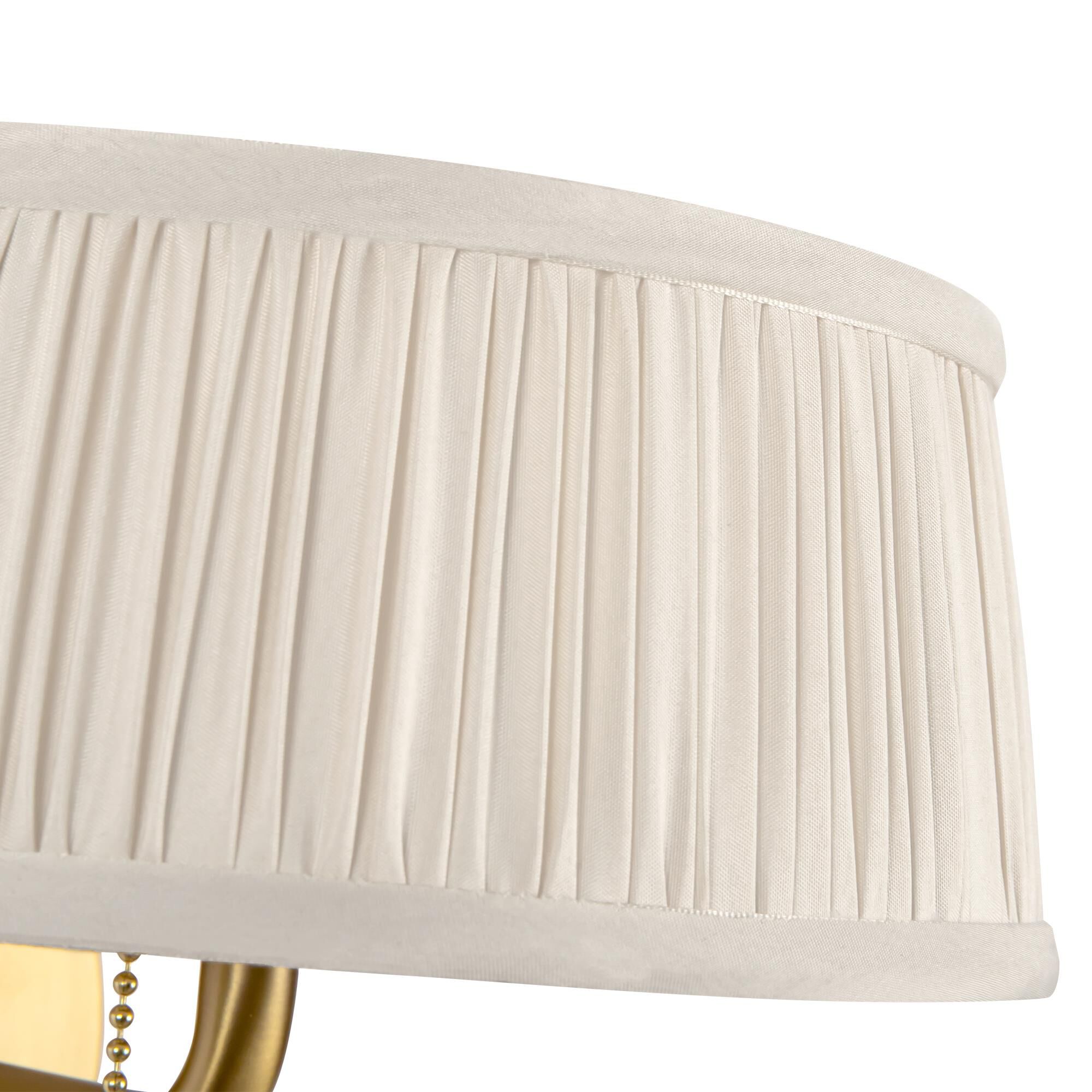 Shown in Brushed Gold finish and White Linen shade