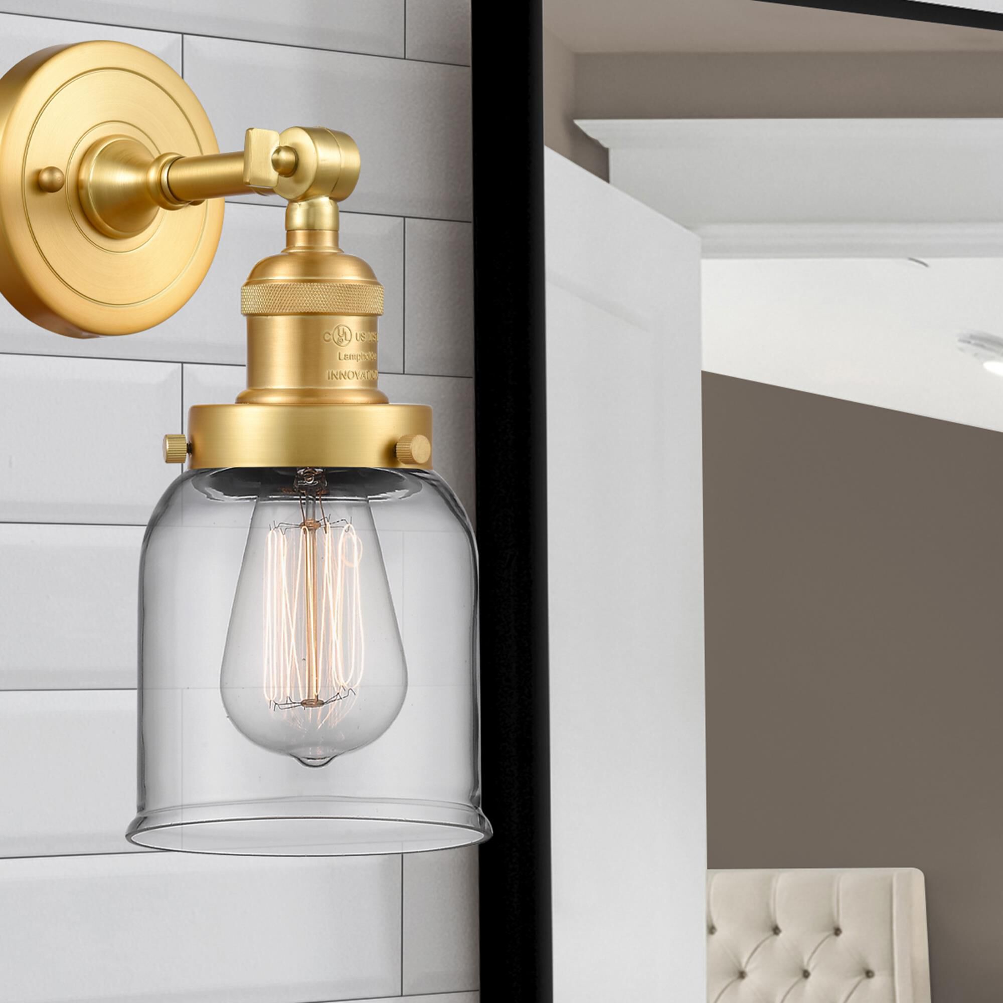 Shown in Satin Gold finish and Clear Small Bell glass