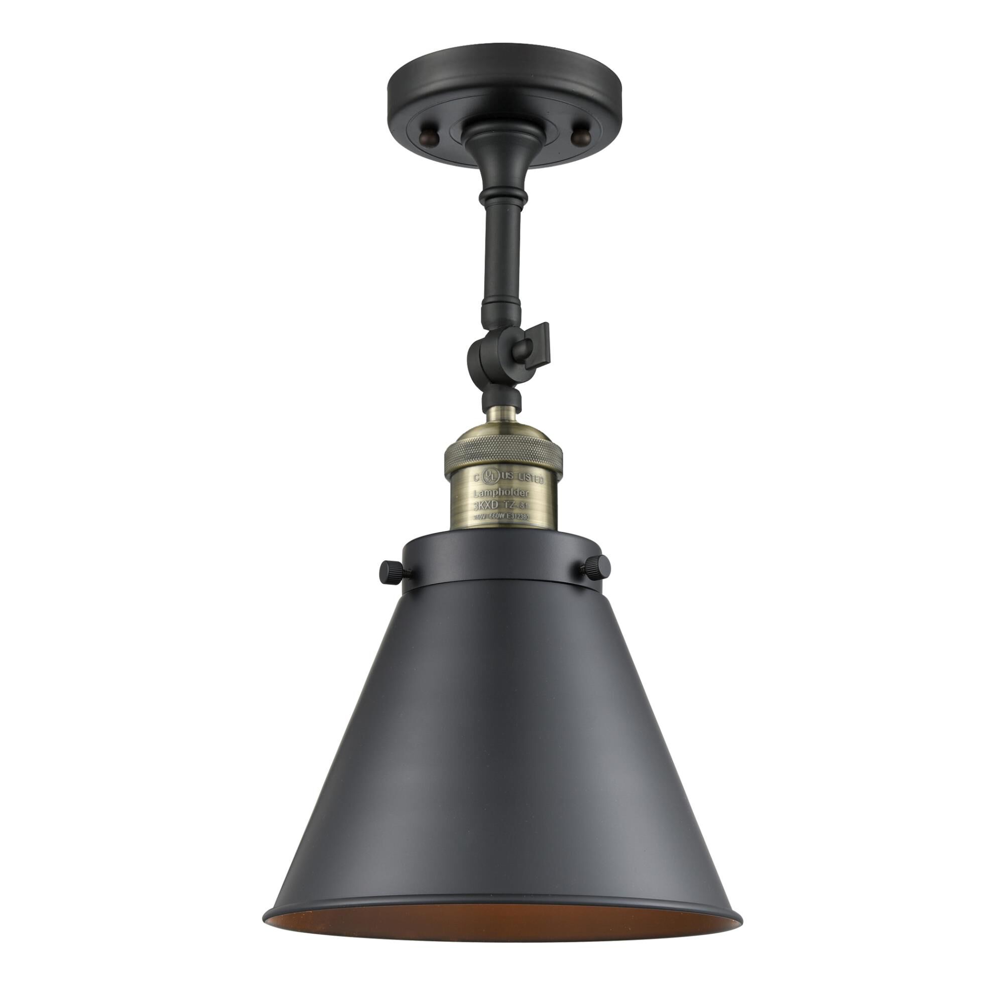 Shown in  Black Antique Brass finish and Metal - Matte Black - Cone shade