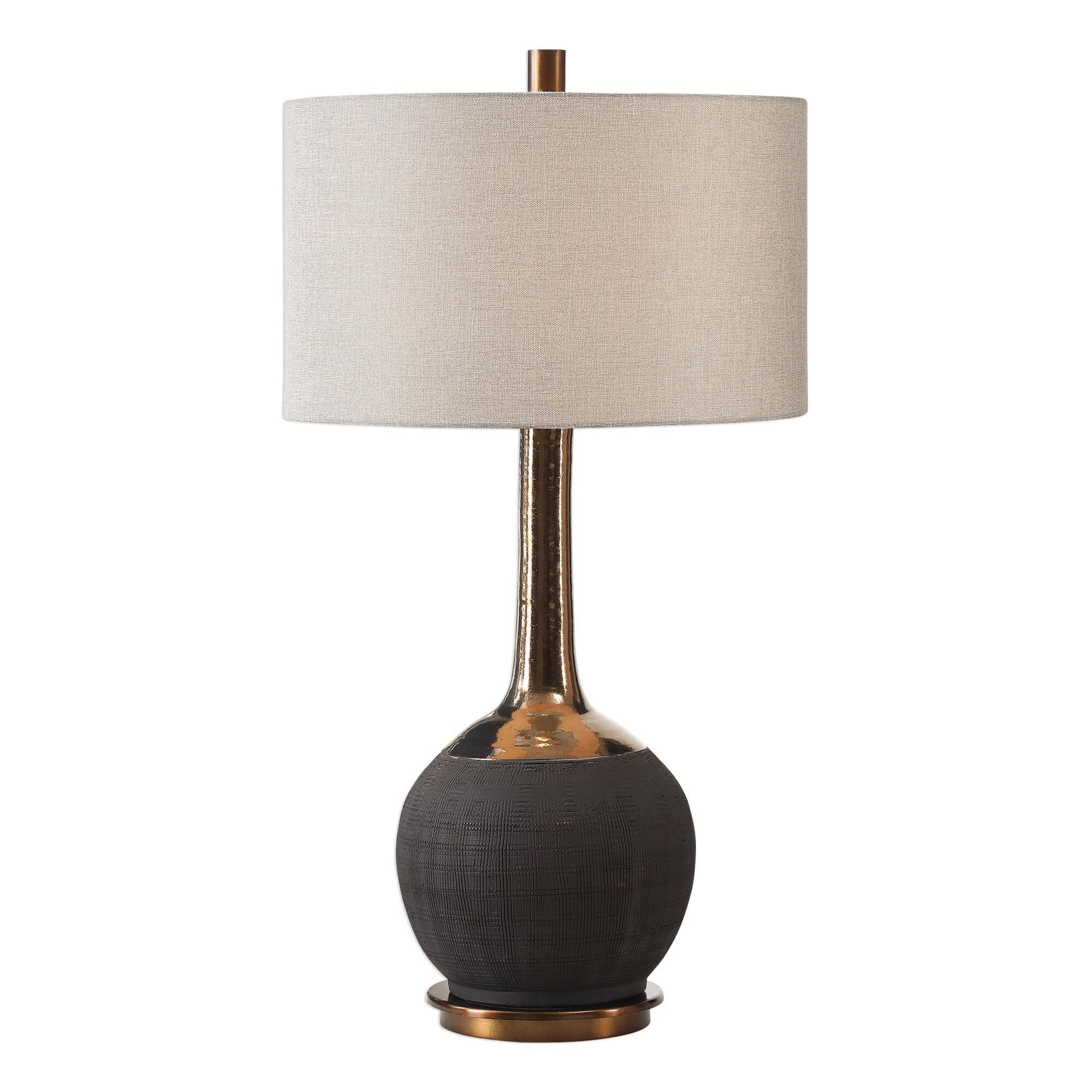 Shown in This Ceramic Base Features A Textured, Matte Black Hand-Scored Body, Accented With A Metallic Golden finish and Round Hardback Drum shade
