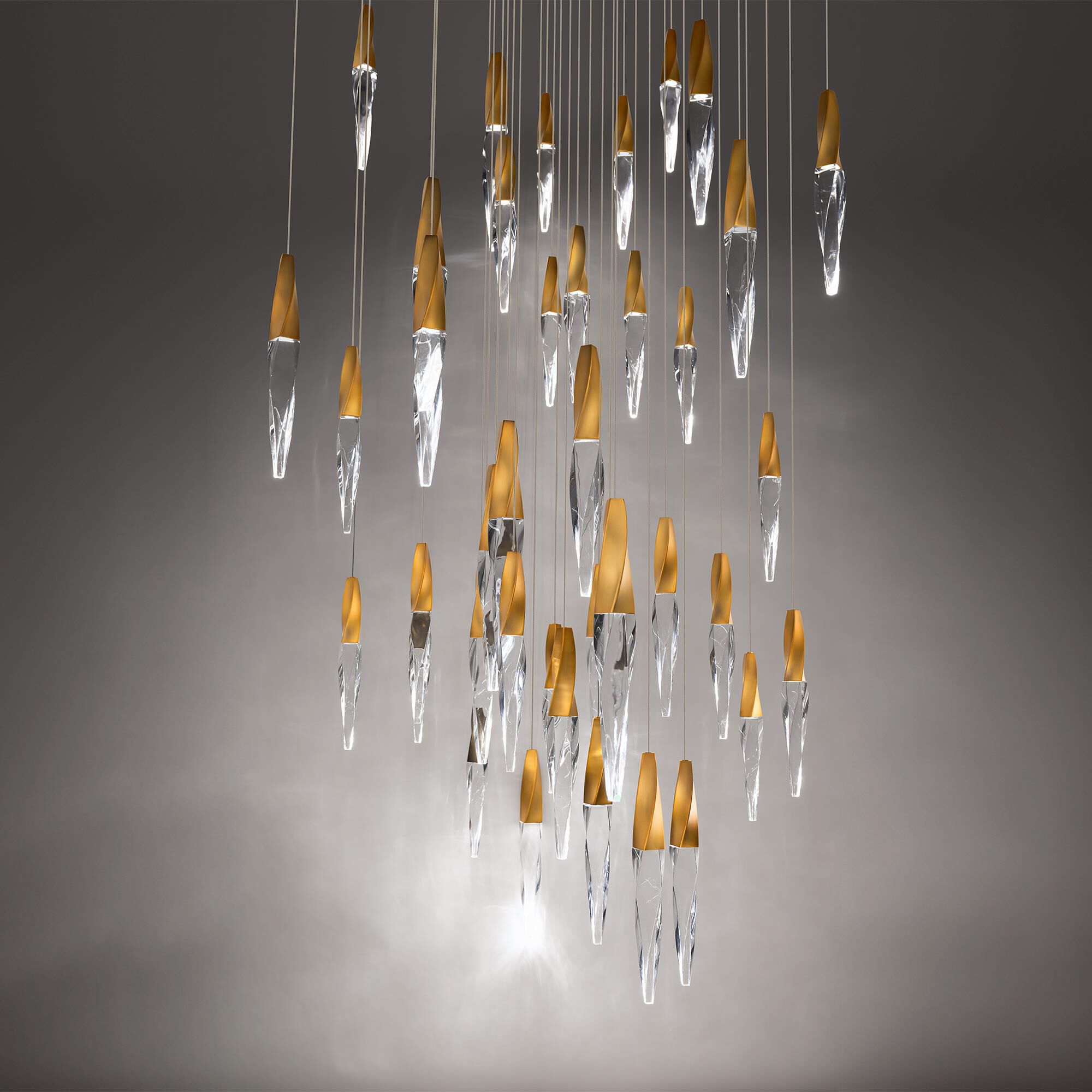 Shown in Aged Brass finish and Optic Crystal crystal