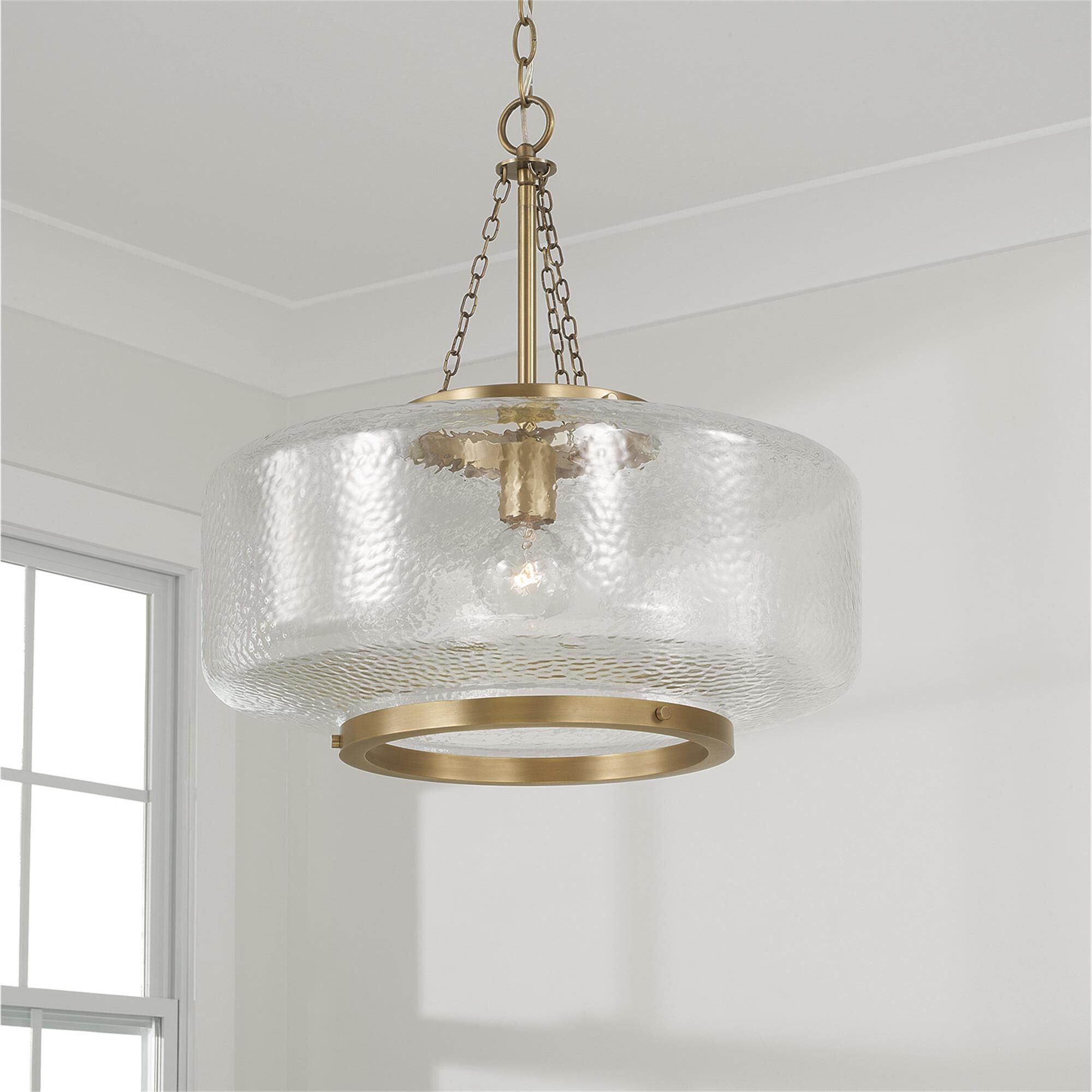 Shown in Aged Brass finish and Organic Hammered glass