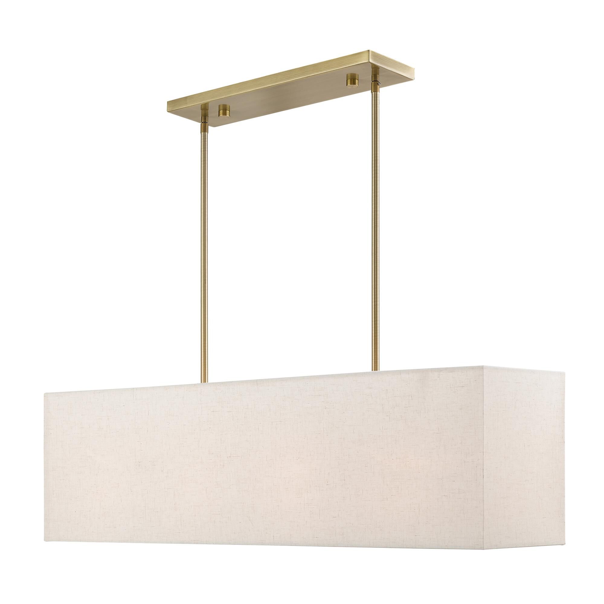 Shown in Antique Brass finish and Hand Crafted Oatmeal Color Hardback Fabric With White Fabric Inside shade