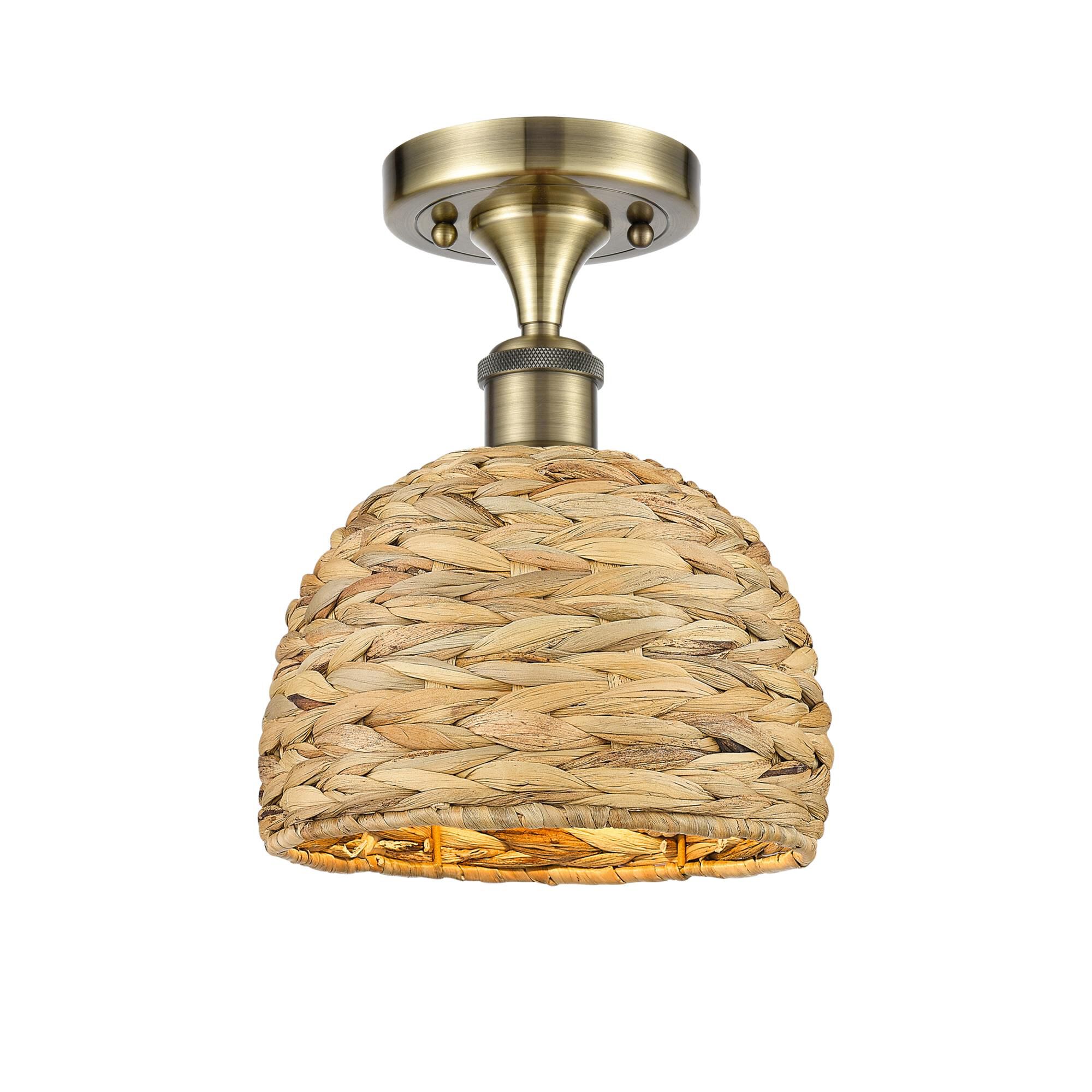 Shown in Antique Brass finish and Natural shade