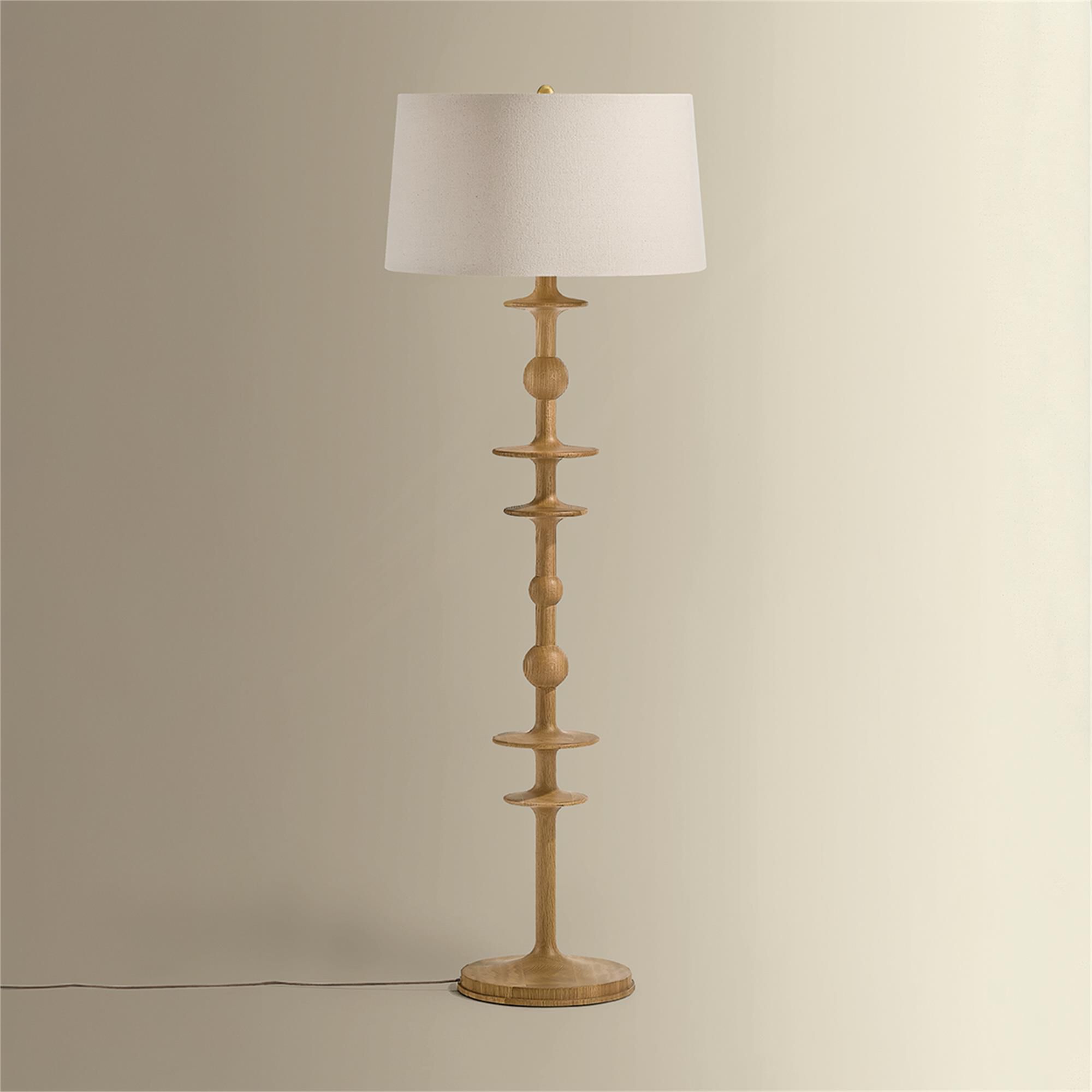 Shown in Aged Brass finish and Wheat Linen shade