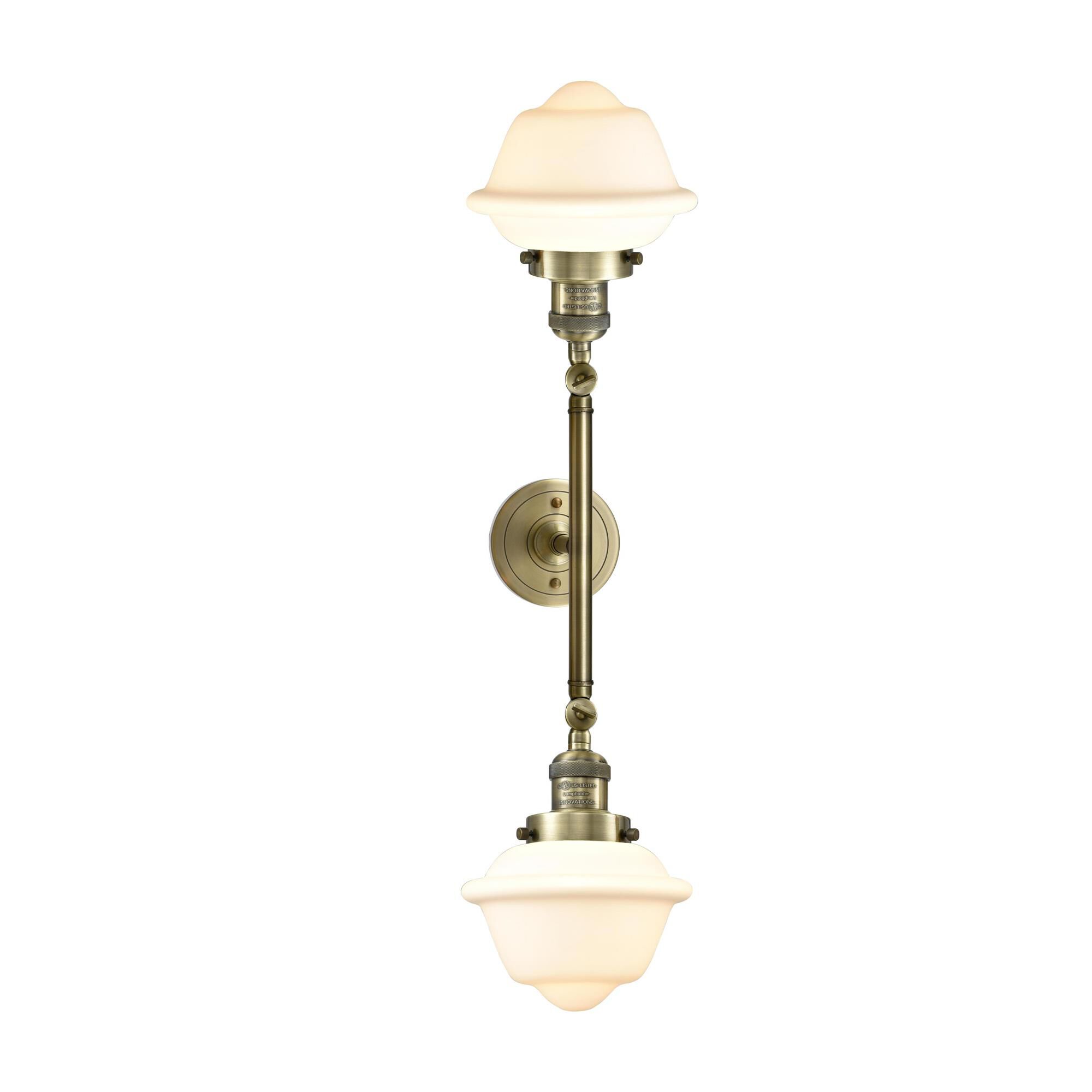 Shown in Antique Brass finish and Matte White Cased glass