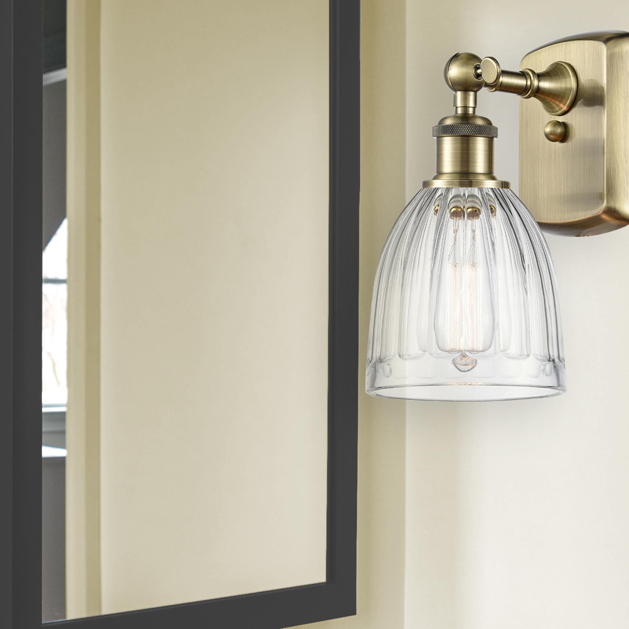 Shown in Antique Brass finish and Clear Brookfield glass and None shade