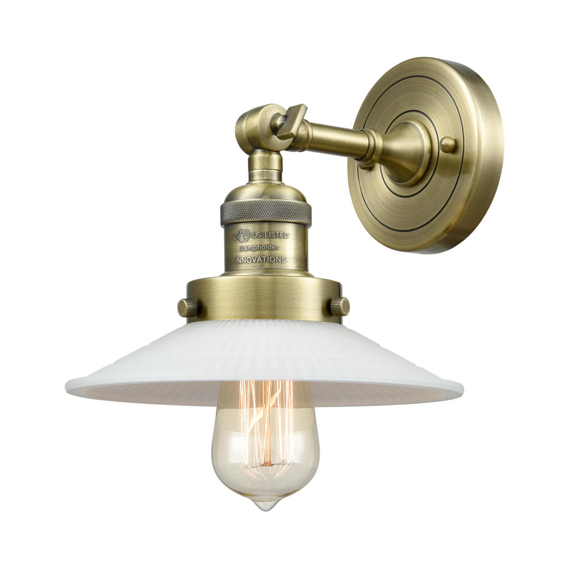 Shown in Antique Brass finish and Matte White Halophane - Cone glass