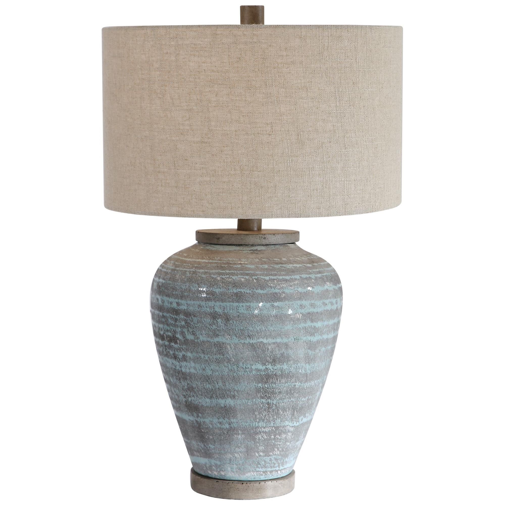 Shown in This Table Lamp Design Features A Ceramic Base With A Global, Bohemian Flair, Finished In A Light Aq finish and Round Drum Hardback shade