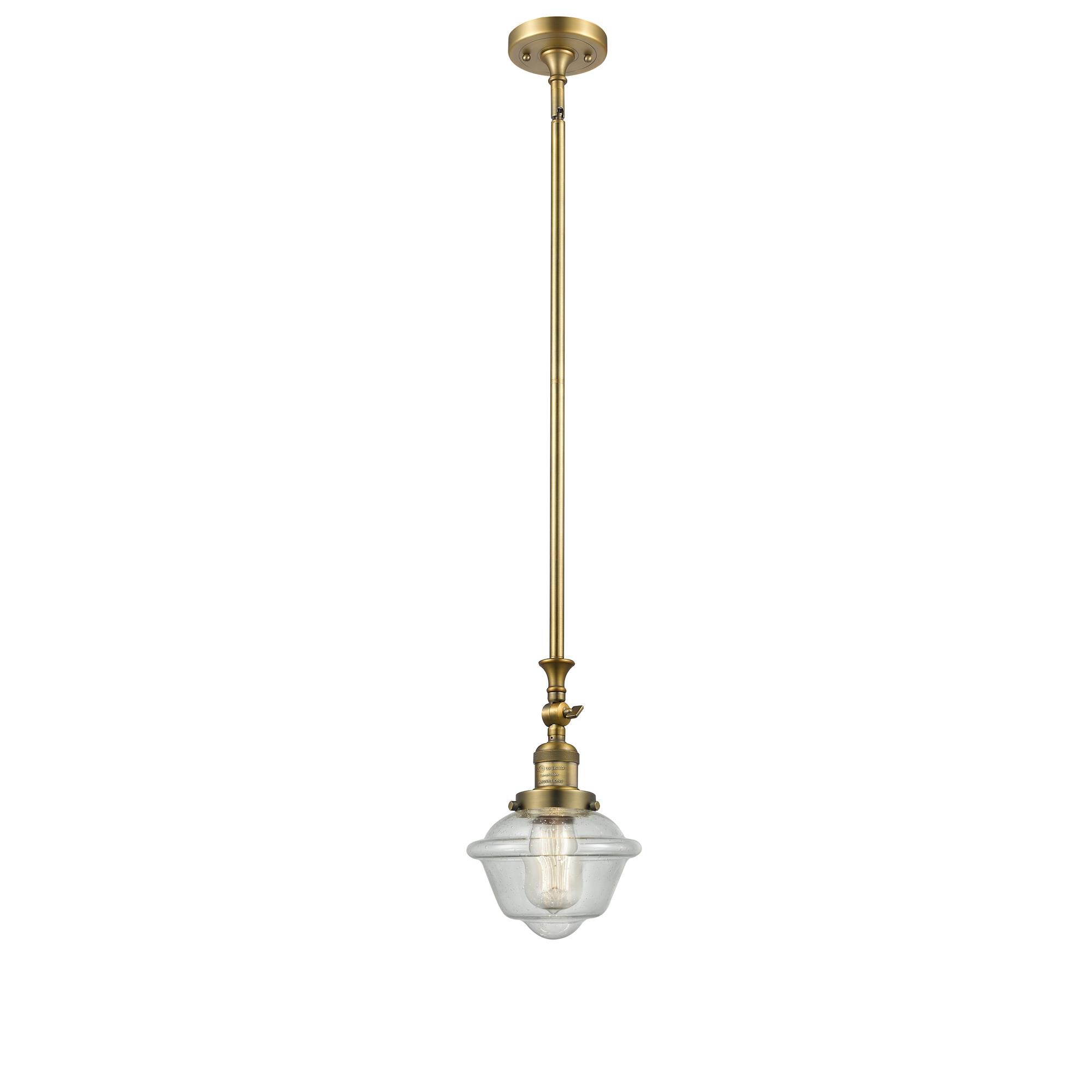 Shown in Brushed Brass finish and Seedy glass