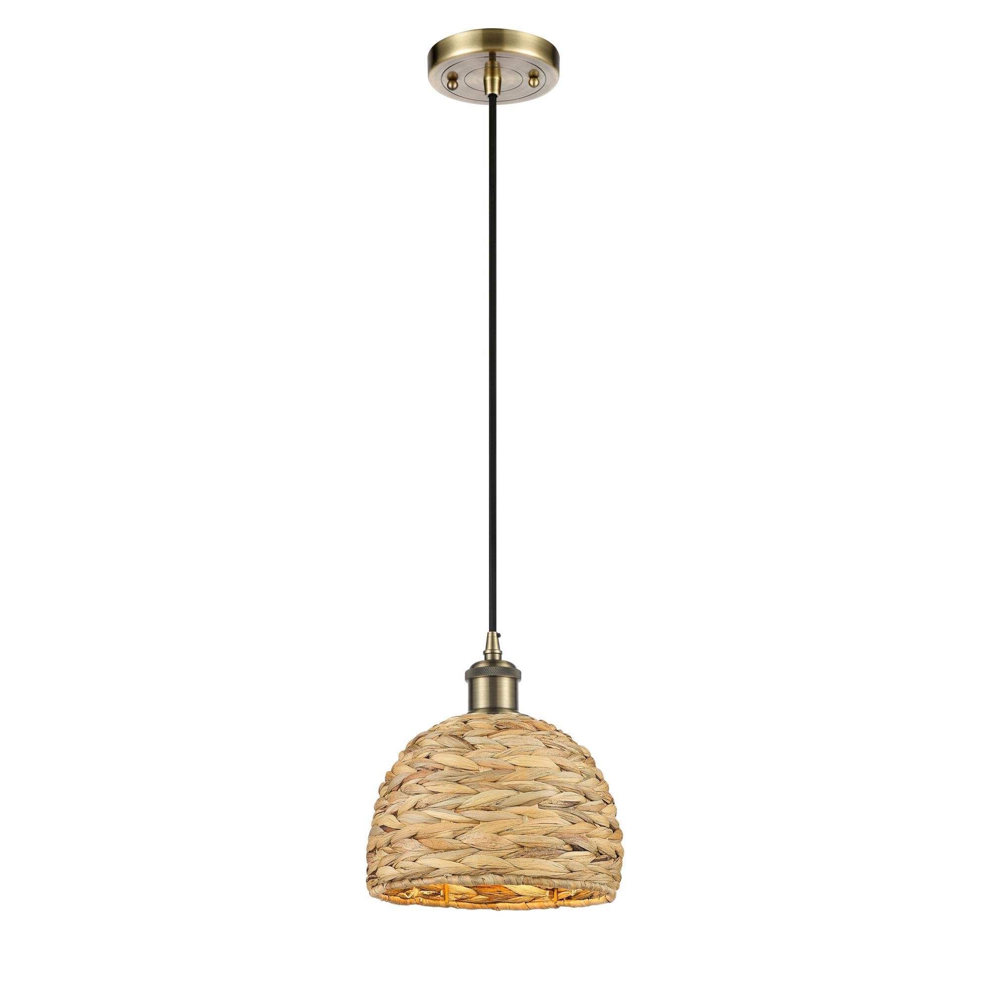 Shown in Antique Brass finish and Natural shade