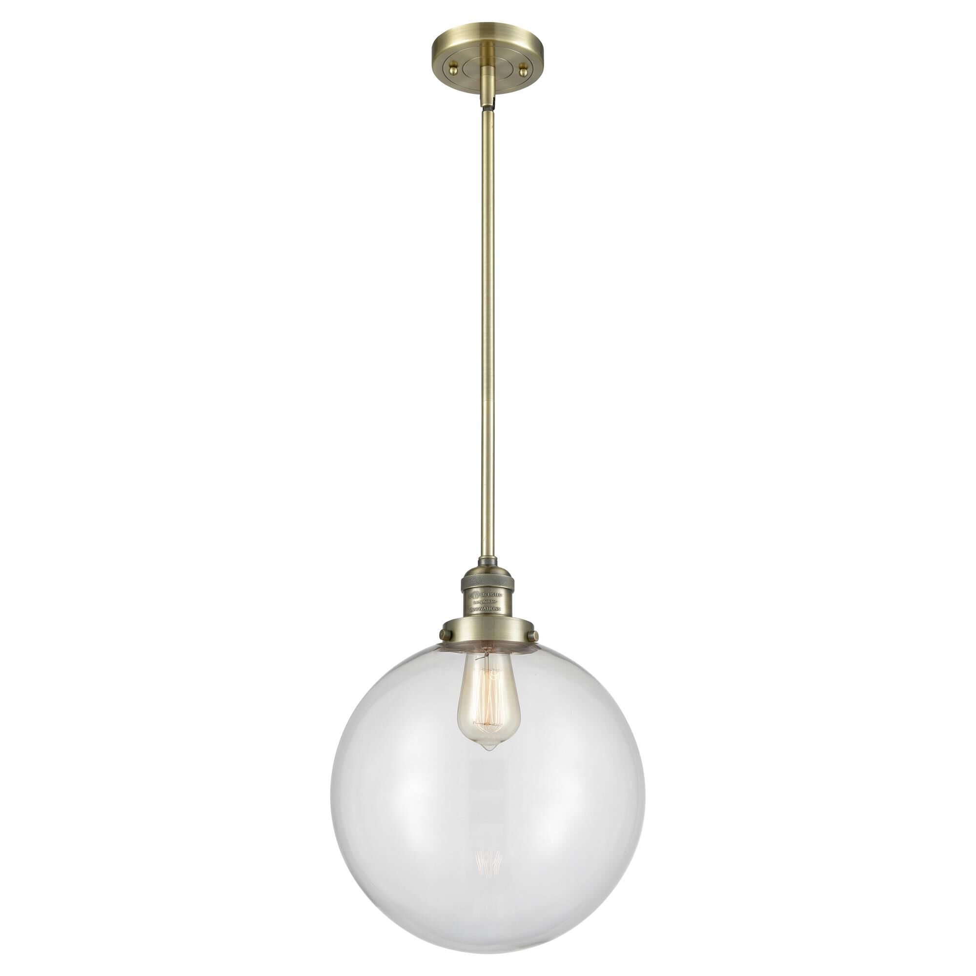 Shown in Antique Brass finish and Clear Beacon glass
