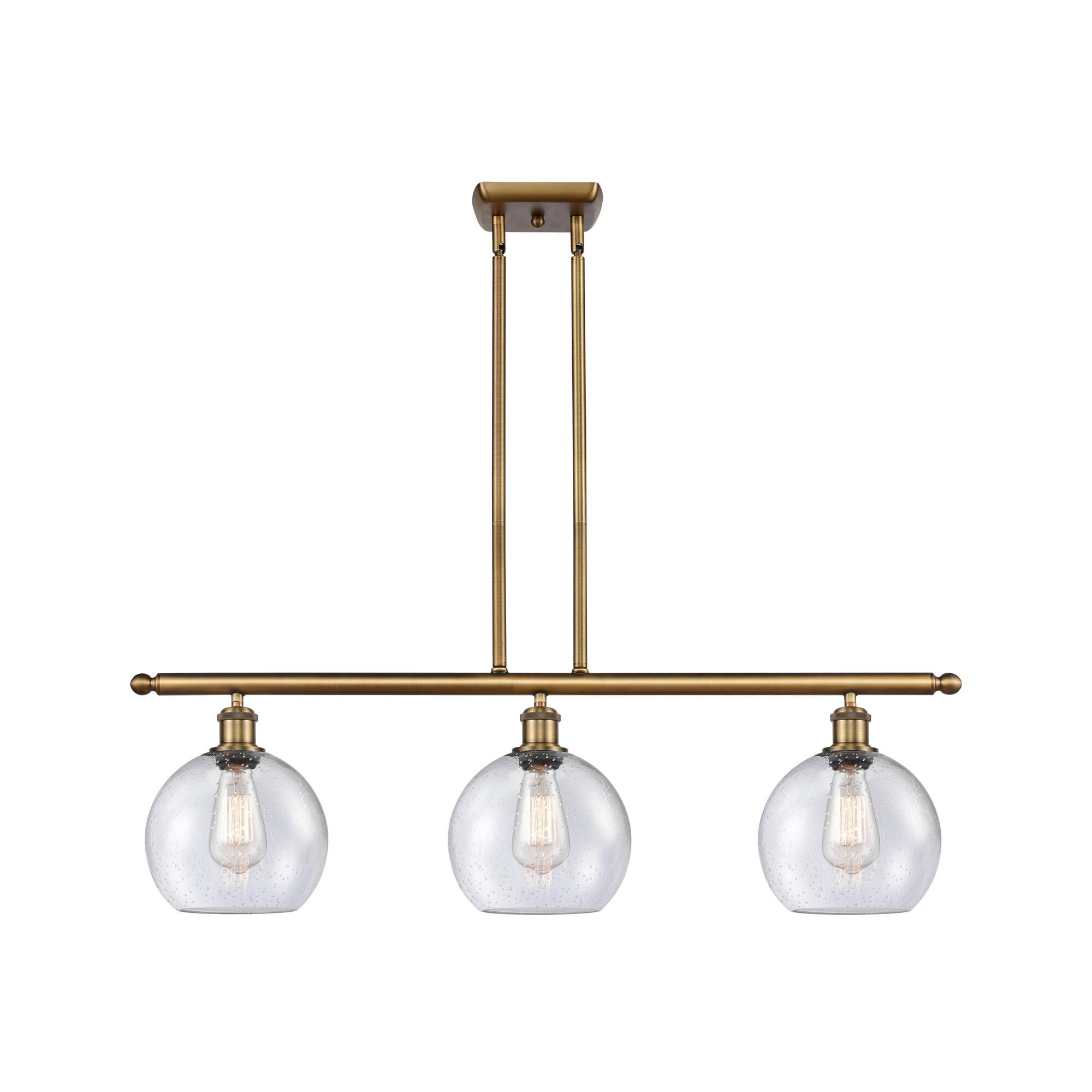 Shown in Brushed Brass finish and Seedy Athens glass