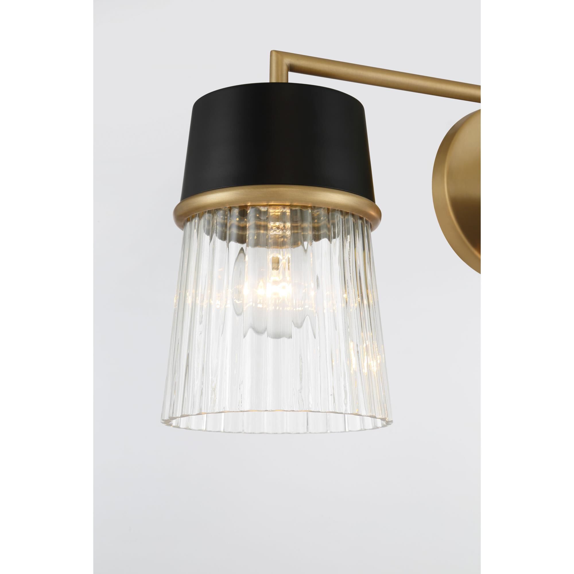 Shown in Legacy Brass finish and Clear Ribbed shade