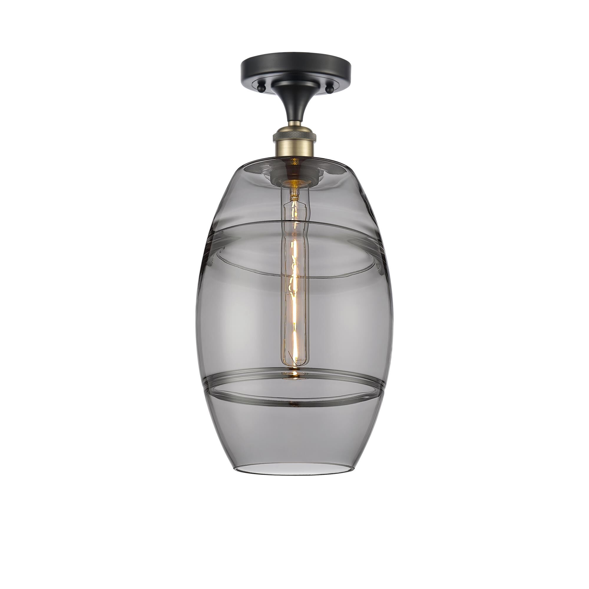 Shown in Black Antique Brass finish and Light Smoke glass