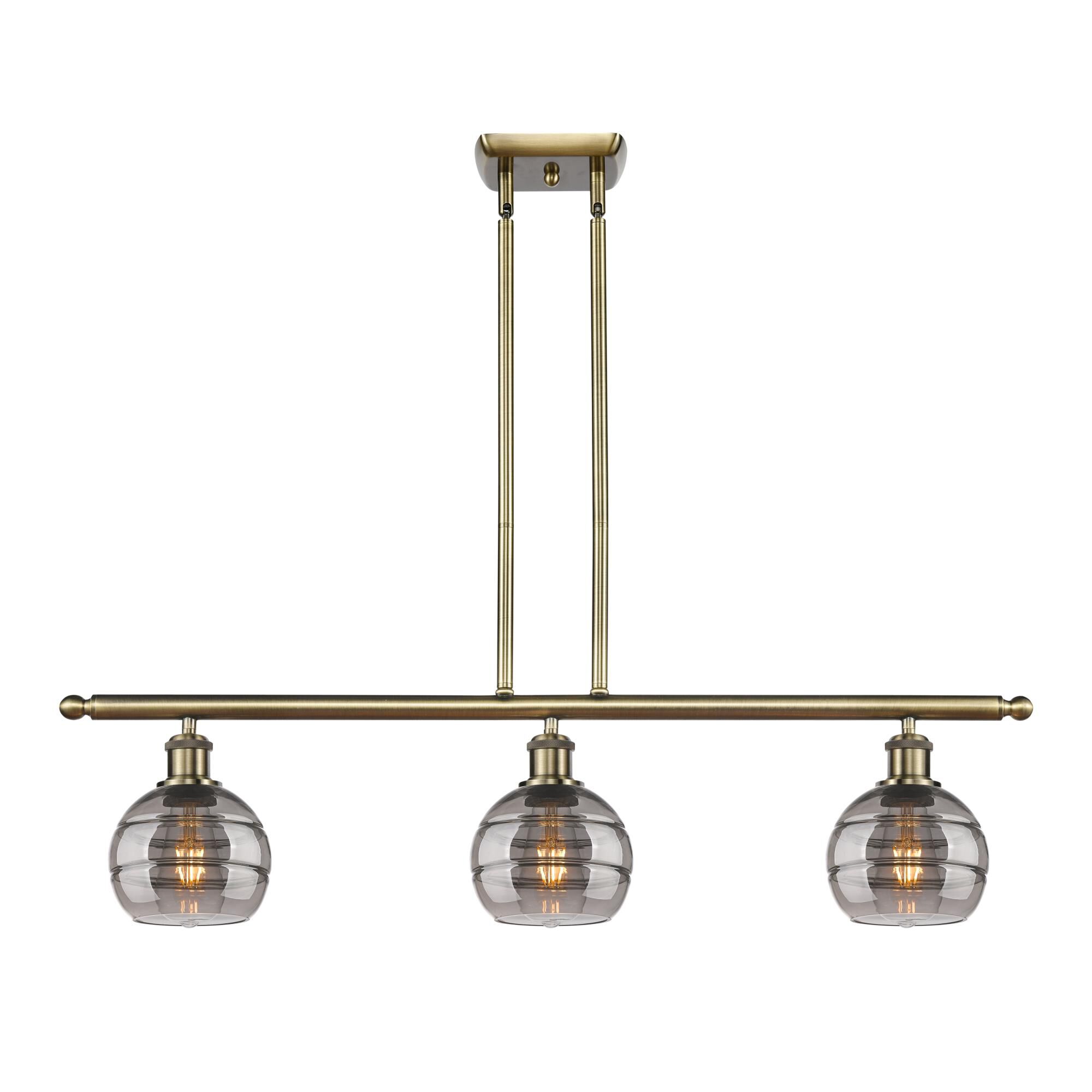 Shown in Antique Brass finish and Light Smoke glass