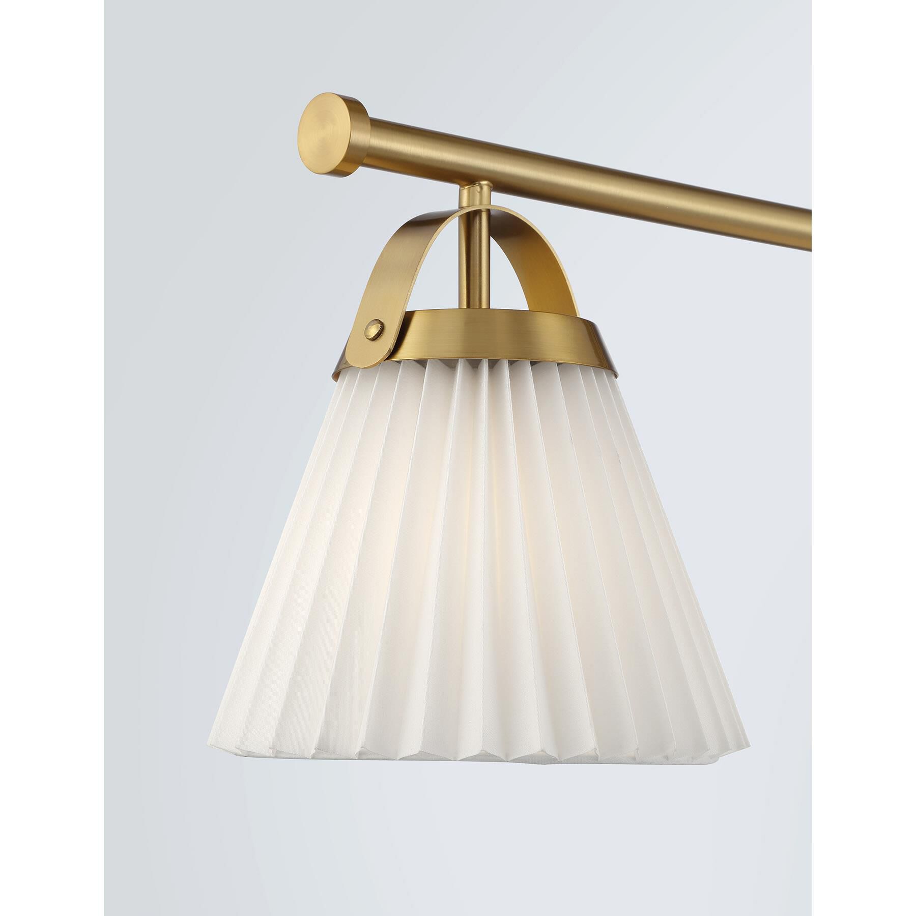 Shown in Natural Brass finish and White Knife Pleated Fabric shade