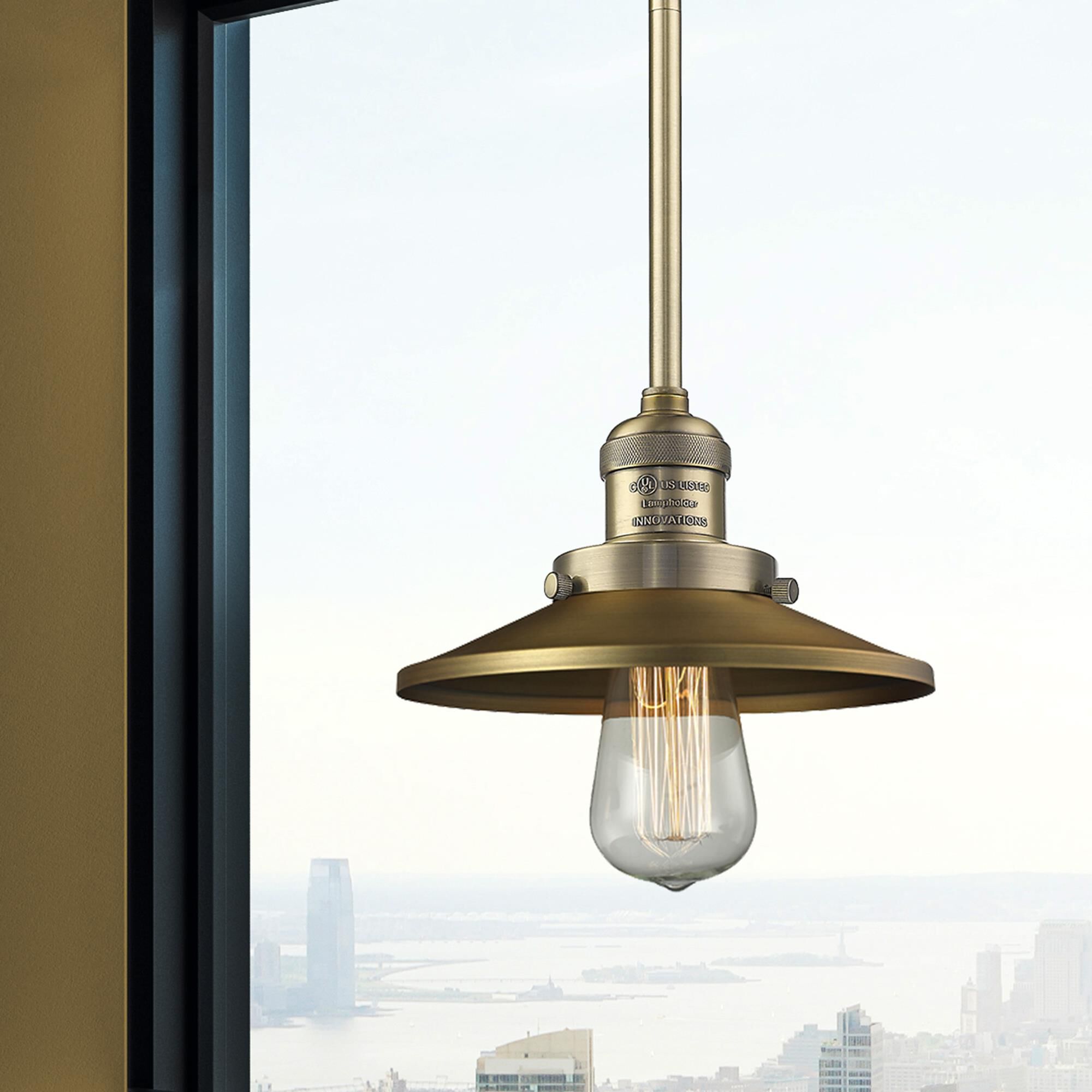 Shown in Brushed Brass finish and Brushed Brass shade